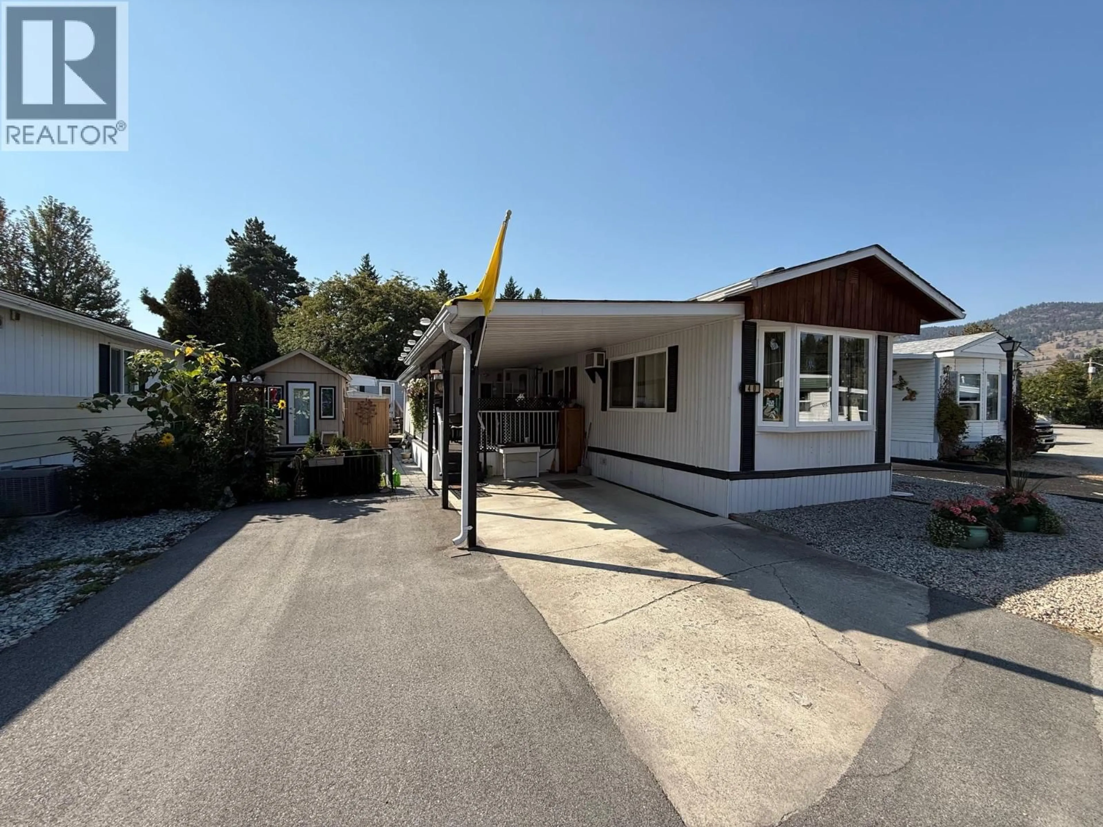 A pic from outside/outdoor area/front of a property/back of a property/a pic from drone, street for 40 - 8712 STEUART STREET, Summerland British Columbia V0H1Z1