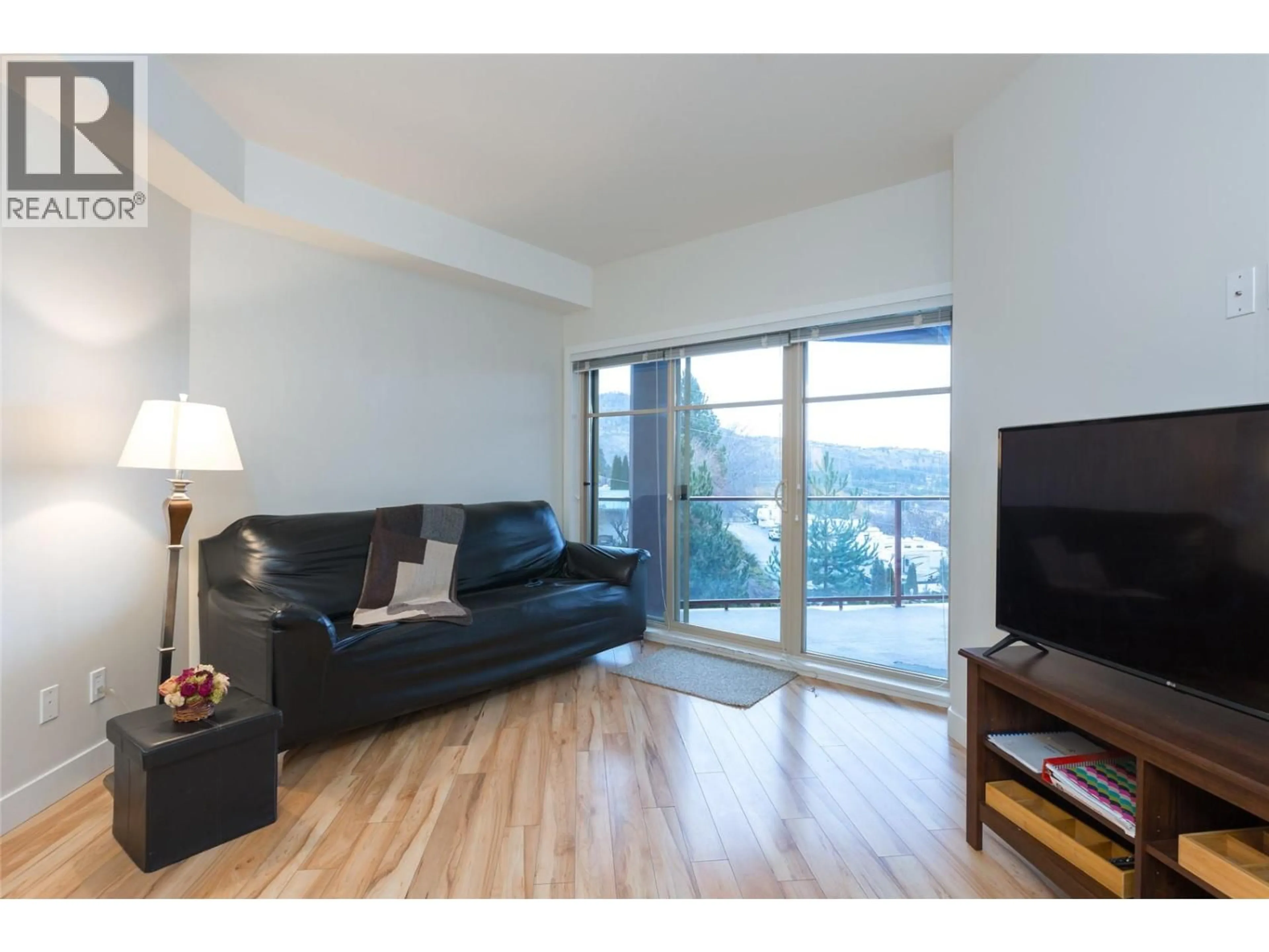 Living room with furniture, wood/laminate floor for 307 - 3205 SKYVIEW LANE, West Kelowna British Columbia V4T2V2