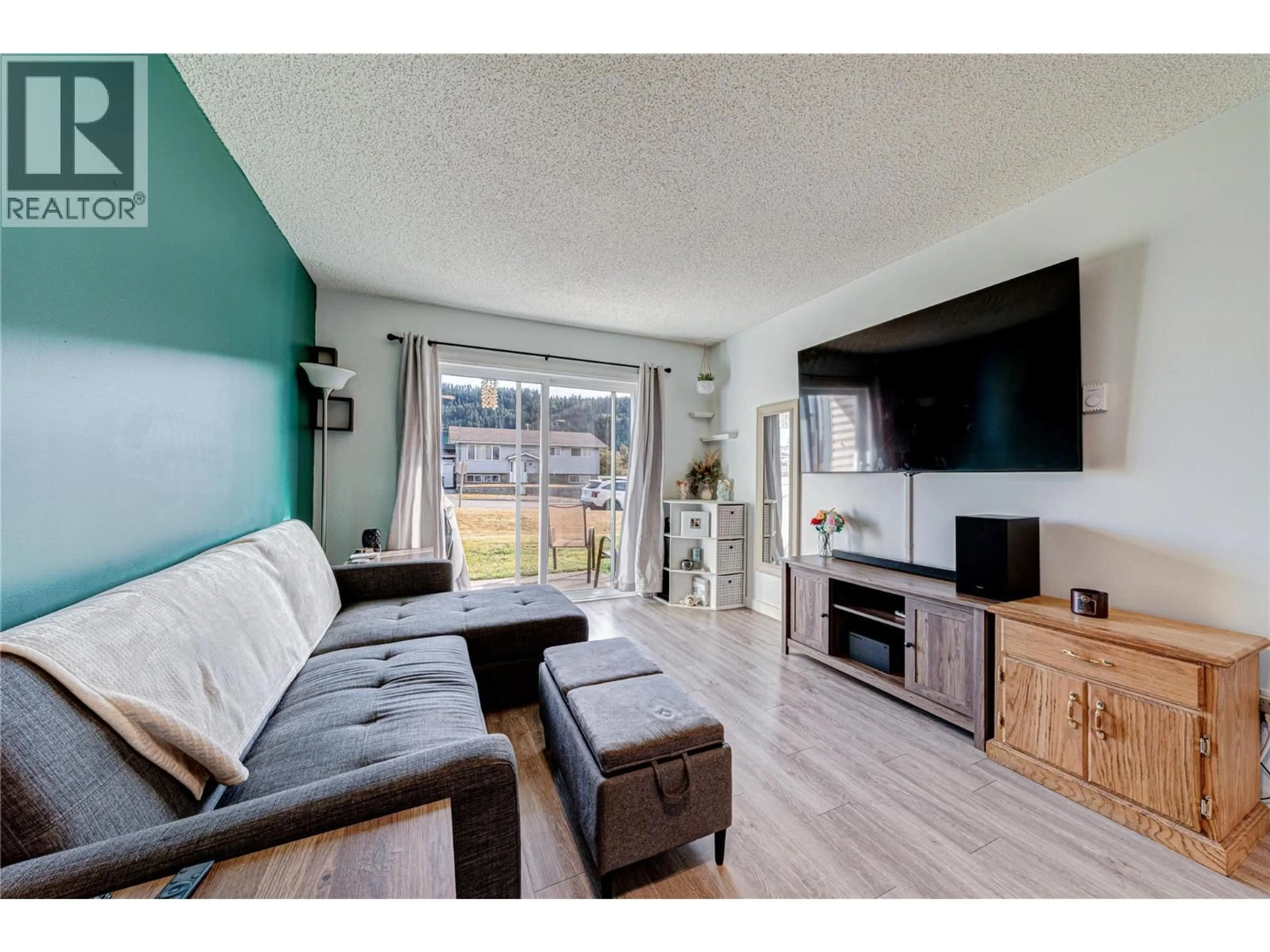Living room with furniture, wood/laminate floor for 111 - 501 ELK STREET, Elkford British Columbia V0B1H0