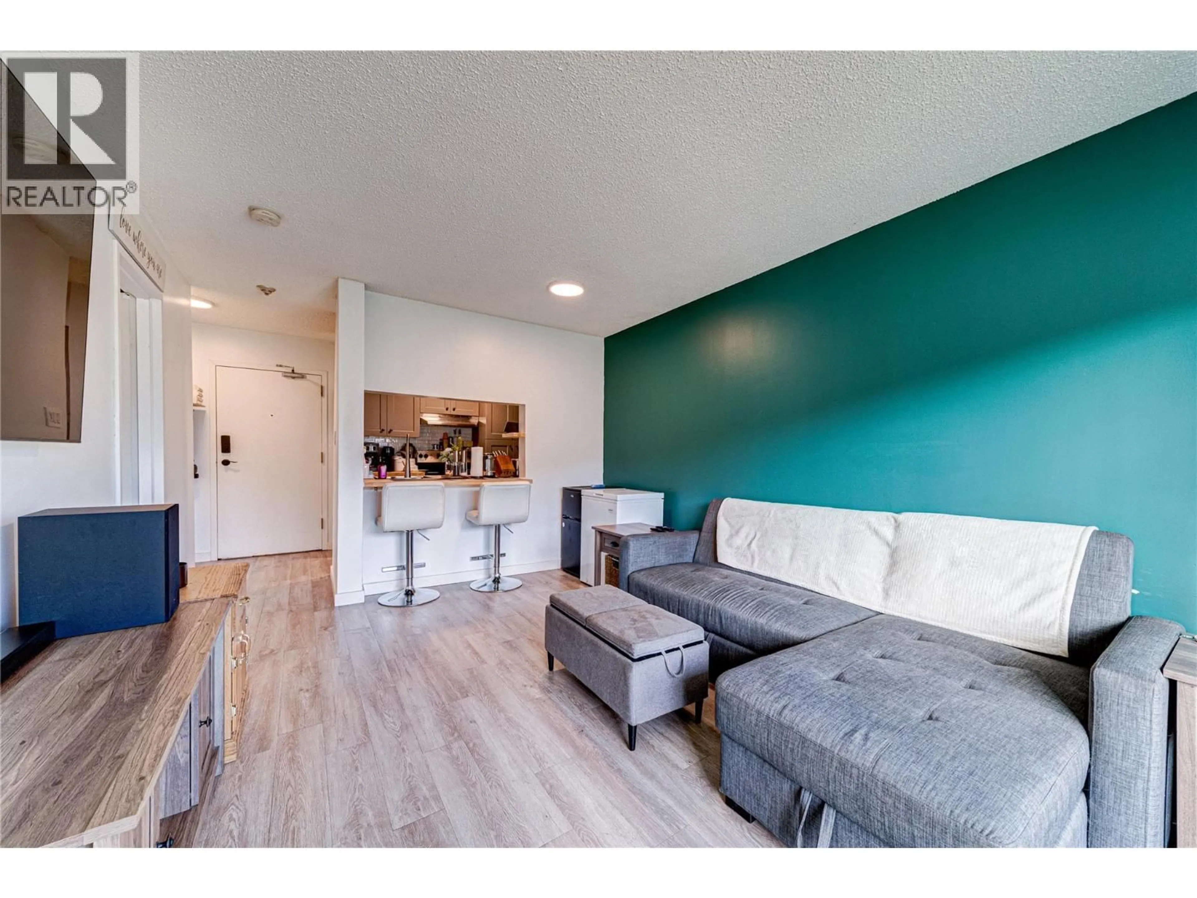 Living room with furniture, wood/laminate floor for 111 - 501 ELK STREET, Elkford British Columbia V0B1H0