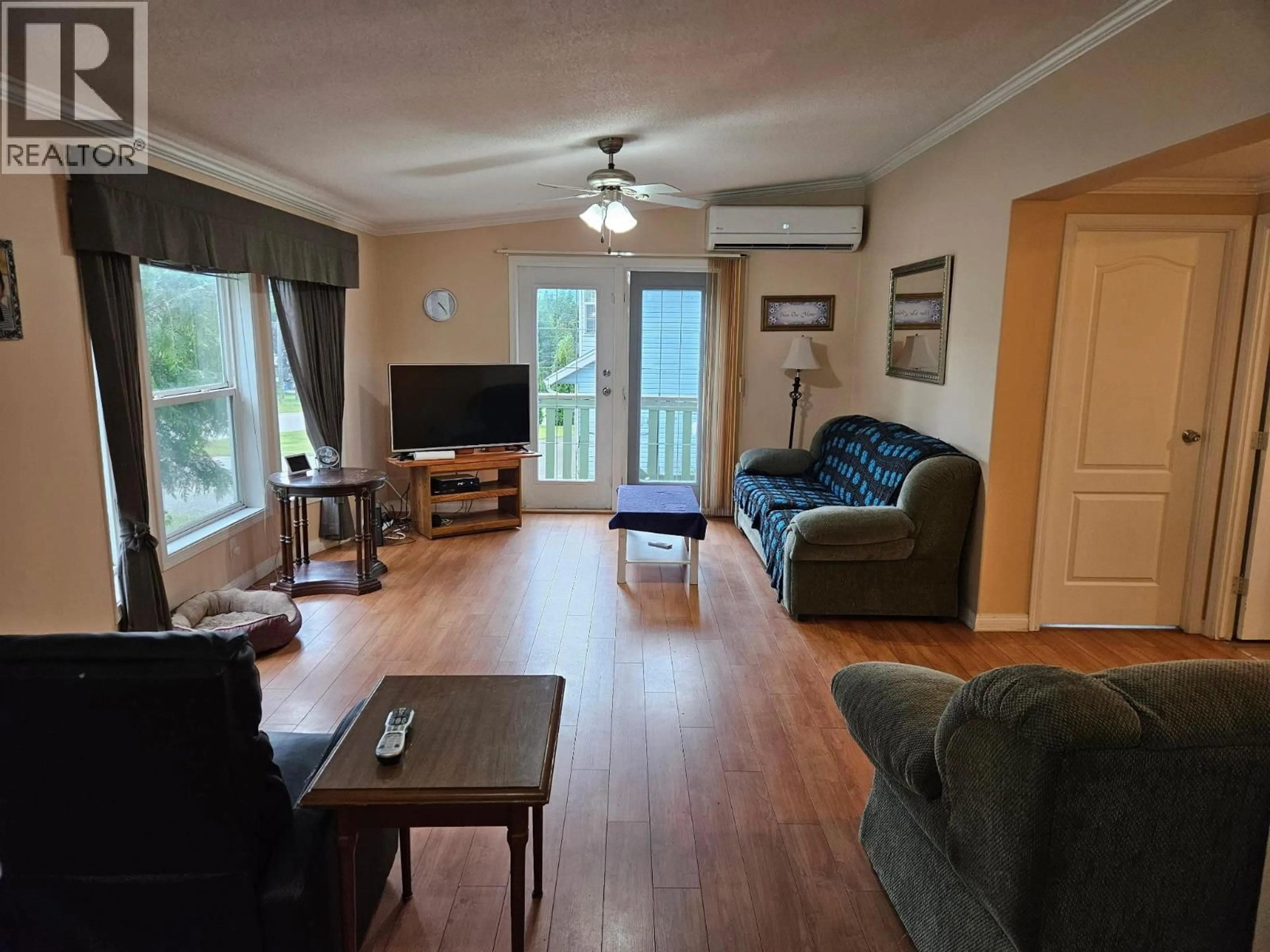 Living room with furniture, wood/laminate floor for 589 FAWN ROAD, Clearwater British Columbia V0E1N1