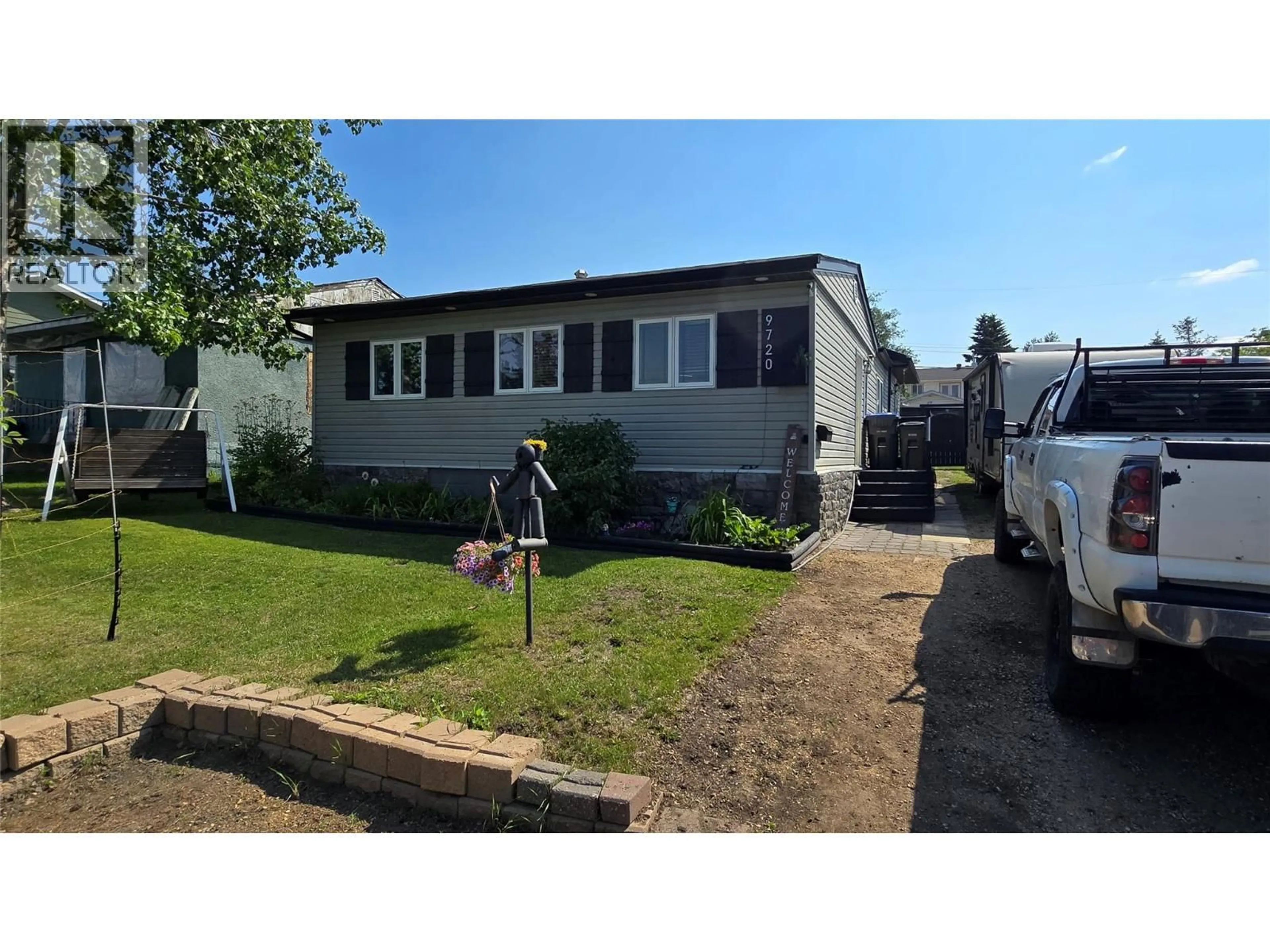 Home with vinyl exterior material, street for 9720 9 STREET, Dawson Creek British Columbia V1G3S6