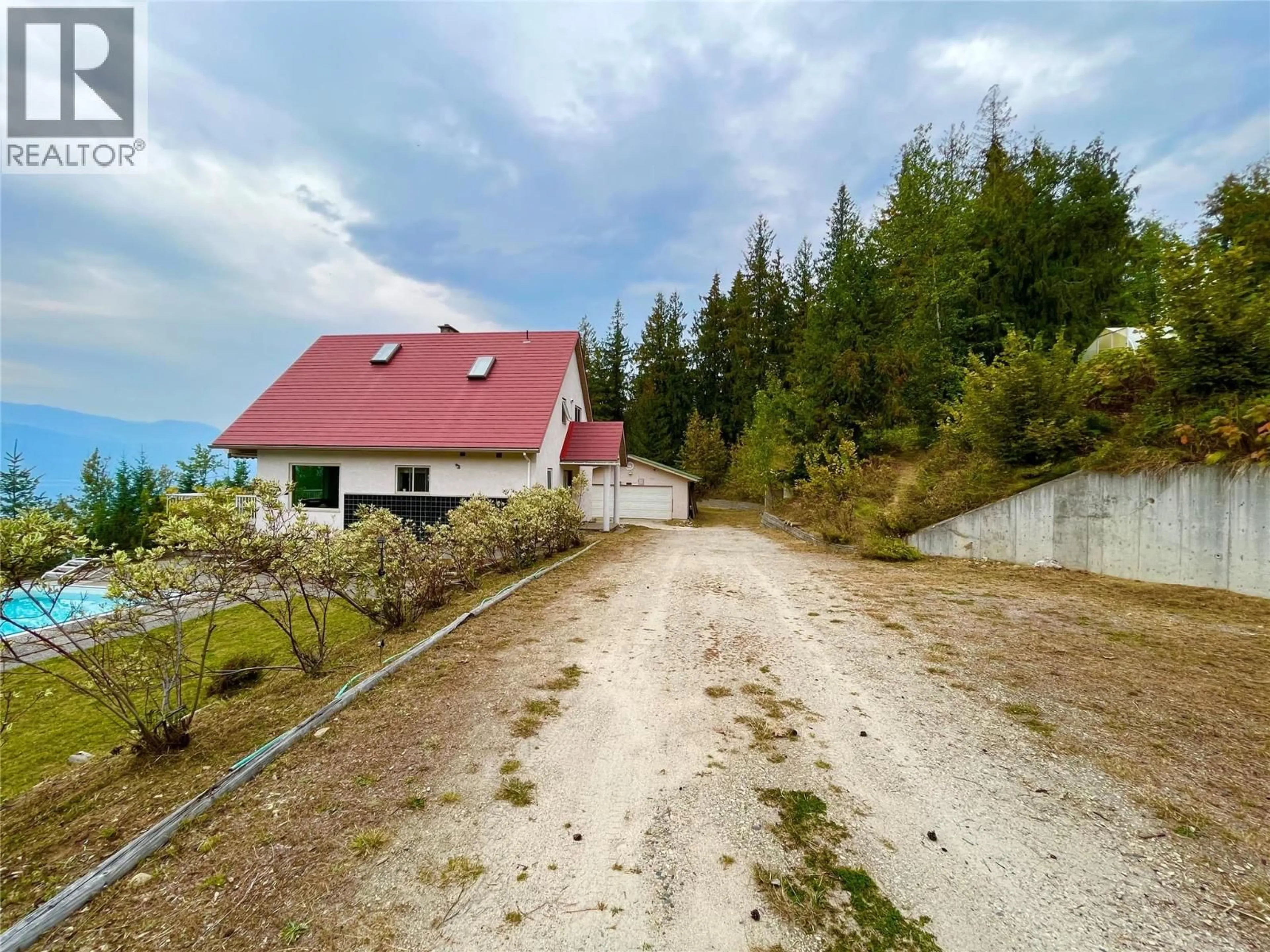 A pic from outside/outdoor area/front of a property/back of a property/a pic from drone, street for 455 CRESCENT BAY ROAD, Nakusp British Columbia V0G1R1
