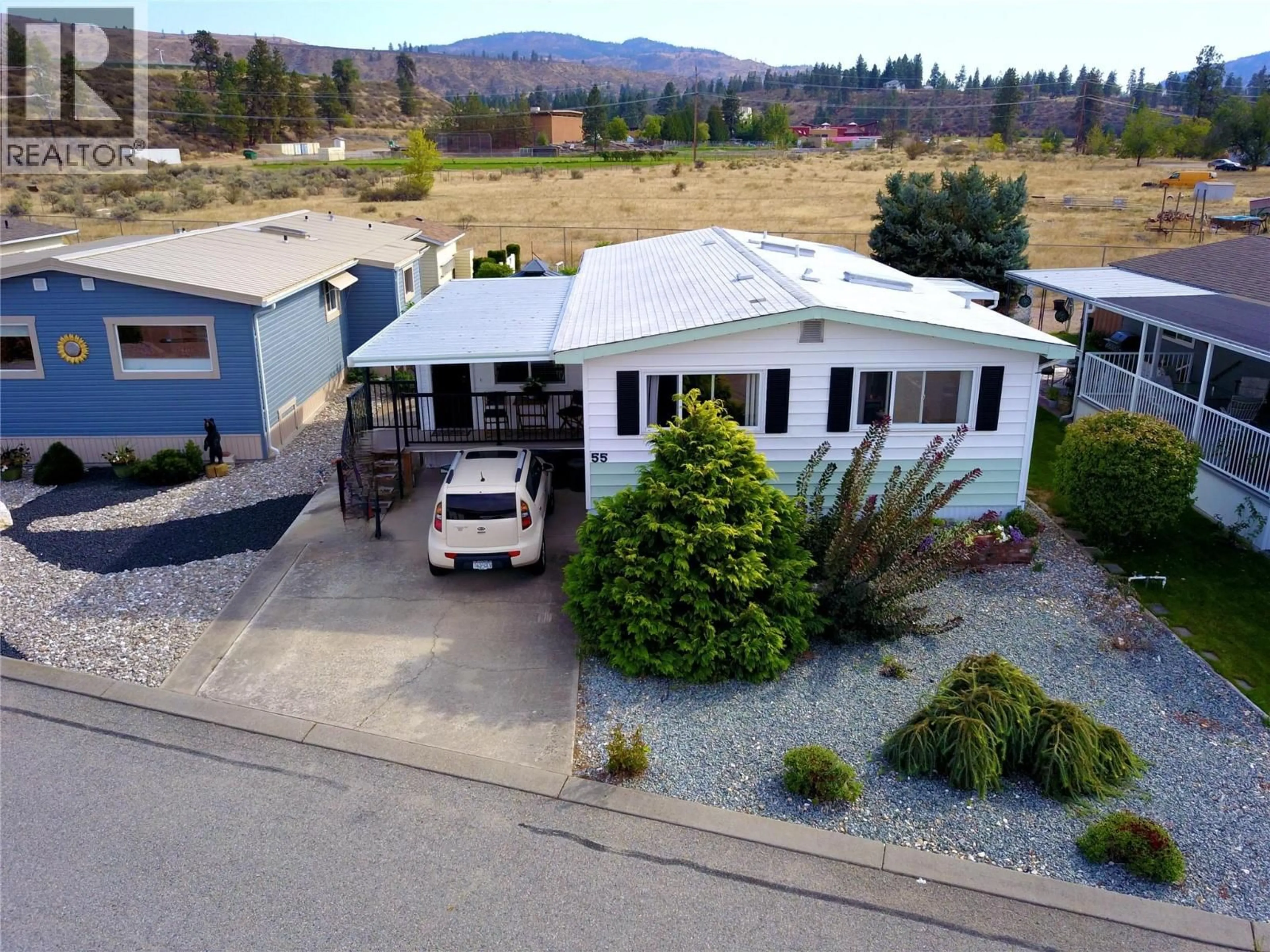 A pic from outside/outdoor area/front of a property/back of a property/a pic from drone, mountain view for 55 - 6601 TUCELNUIT DRIVE, Oliver British Columbia V0H1T3
