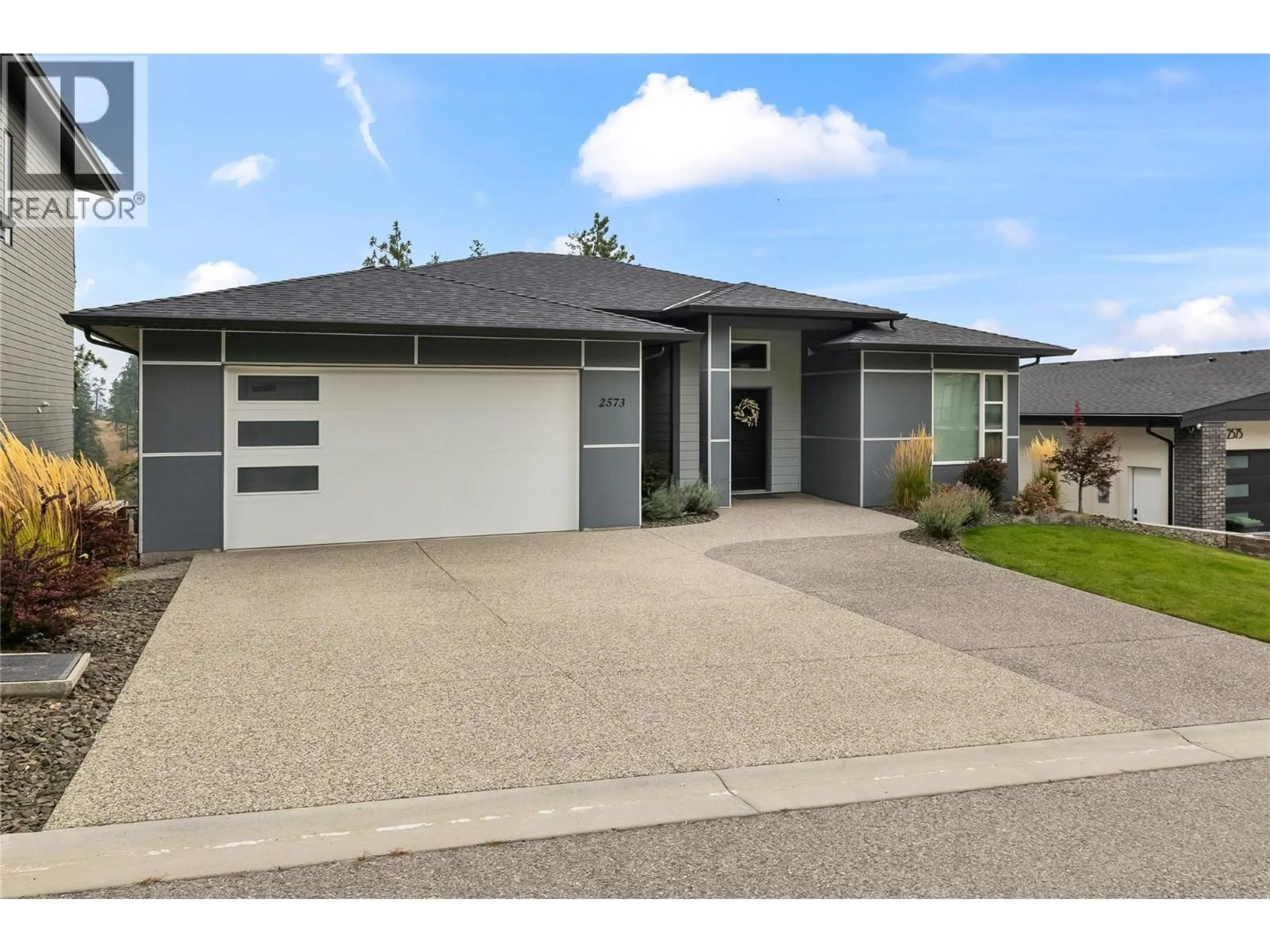 Home with vinyl exterior material, street for 2573 CROWN CREST DRIVE, West Kelowna British Columbia V4T3N3