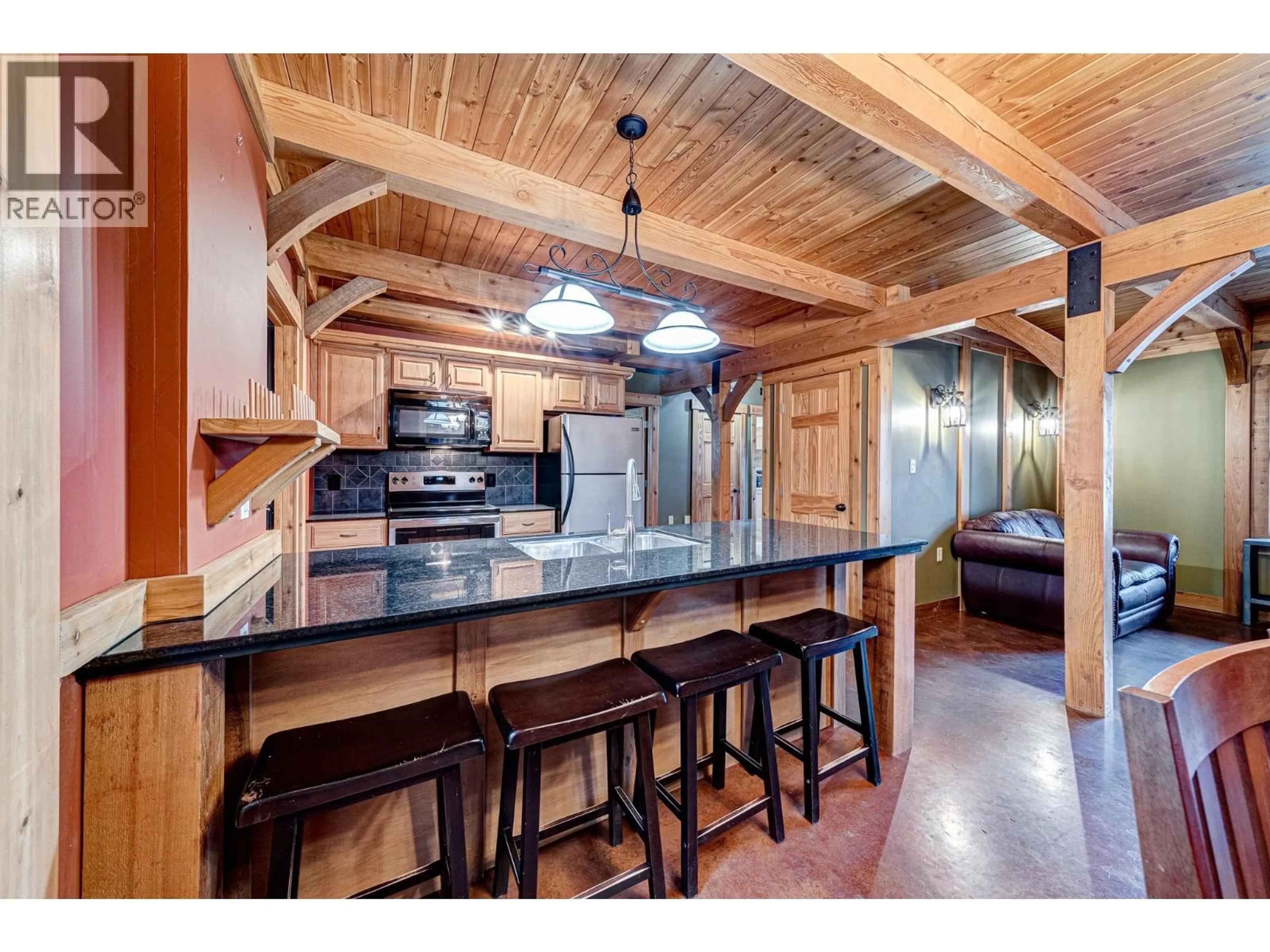 Open concept kitchen, wood/laminate floor for 1325 WILDWOOD DRIVE, Sparwood British Columbia V0B2G2
