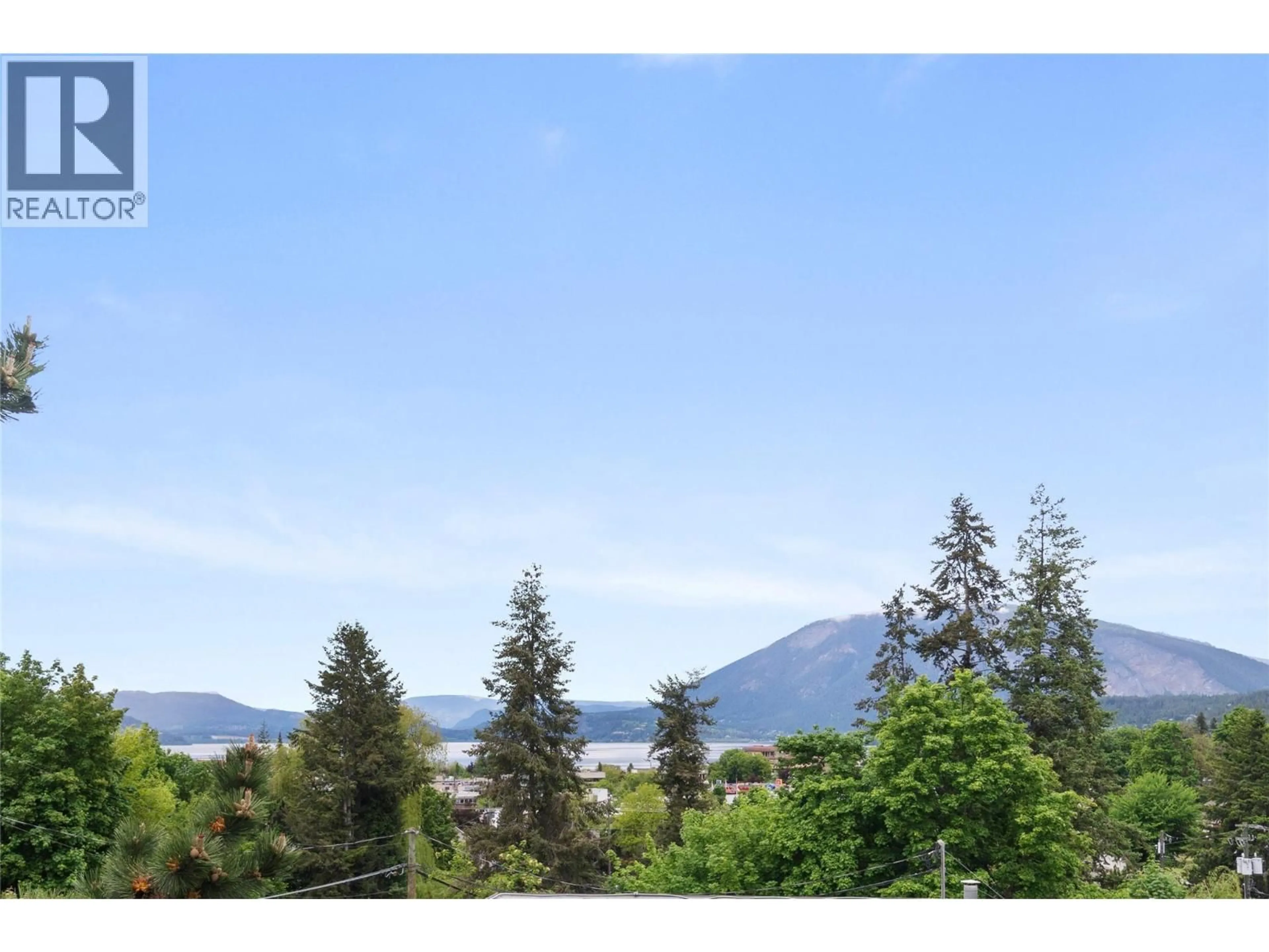 A pic from outside/outdoor area/front of a property/back of a property/a pic from drone, water/lake/river/ocean view for 314 - 250 5 STREET SOUTHEAST, Salmon Arm British Columbia V1E1J8