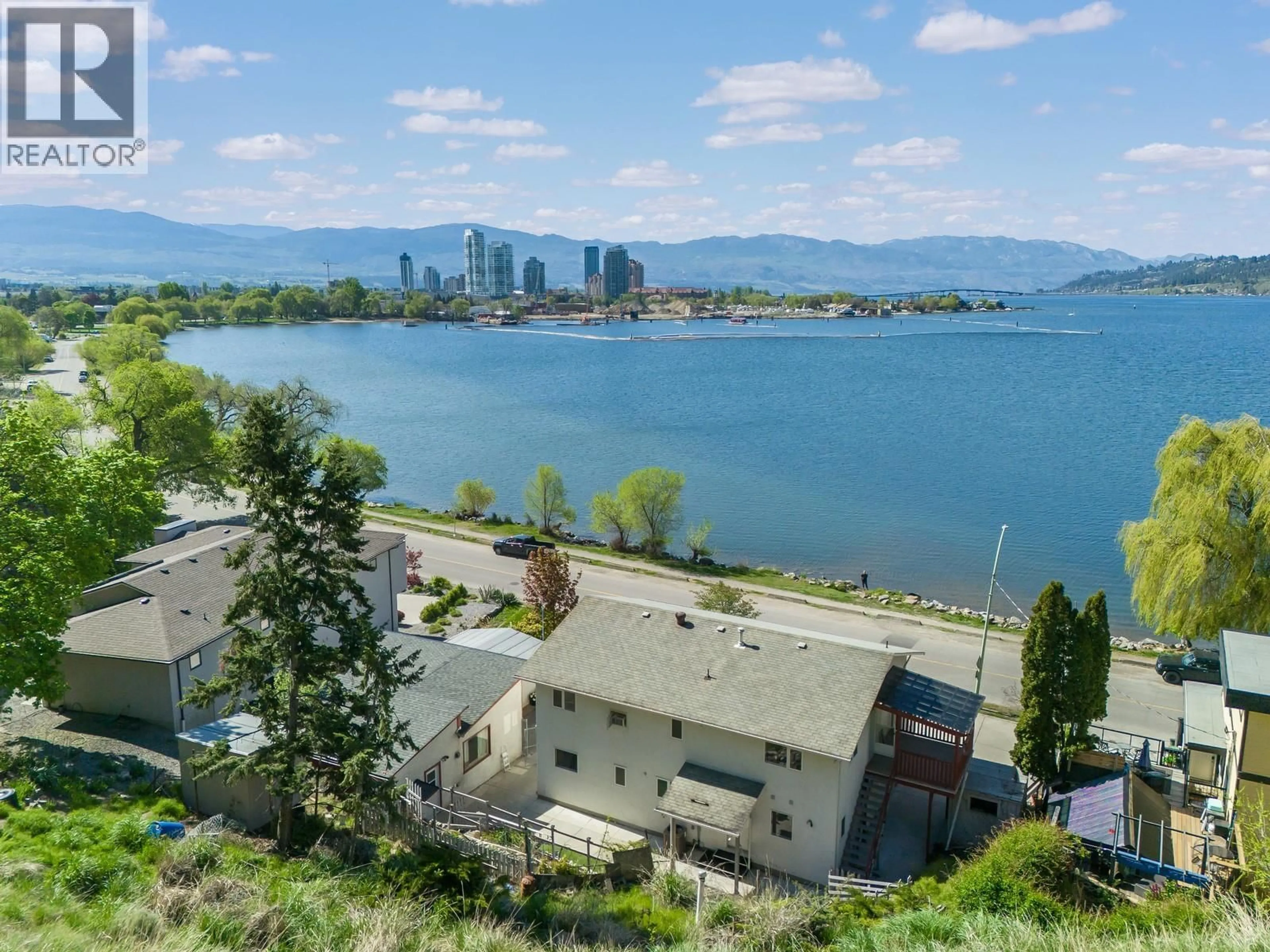 A pic from outside/outdoor area/front of a property/back of a property/a pic from drone, water/lake/river/ocean view for 457 POPLAR POINT DRIVE, Kelowna British Columbia V1Y1Y2