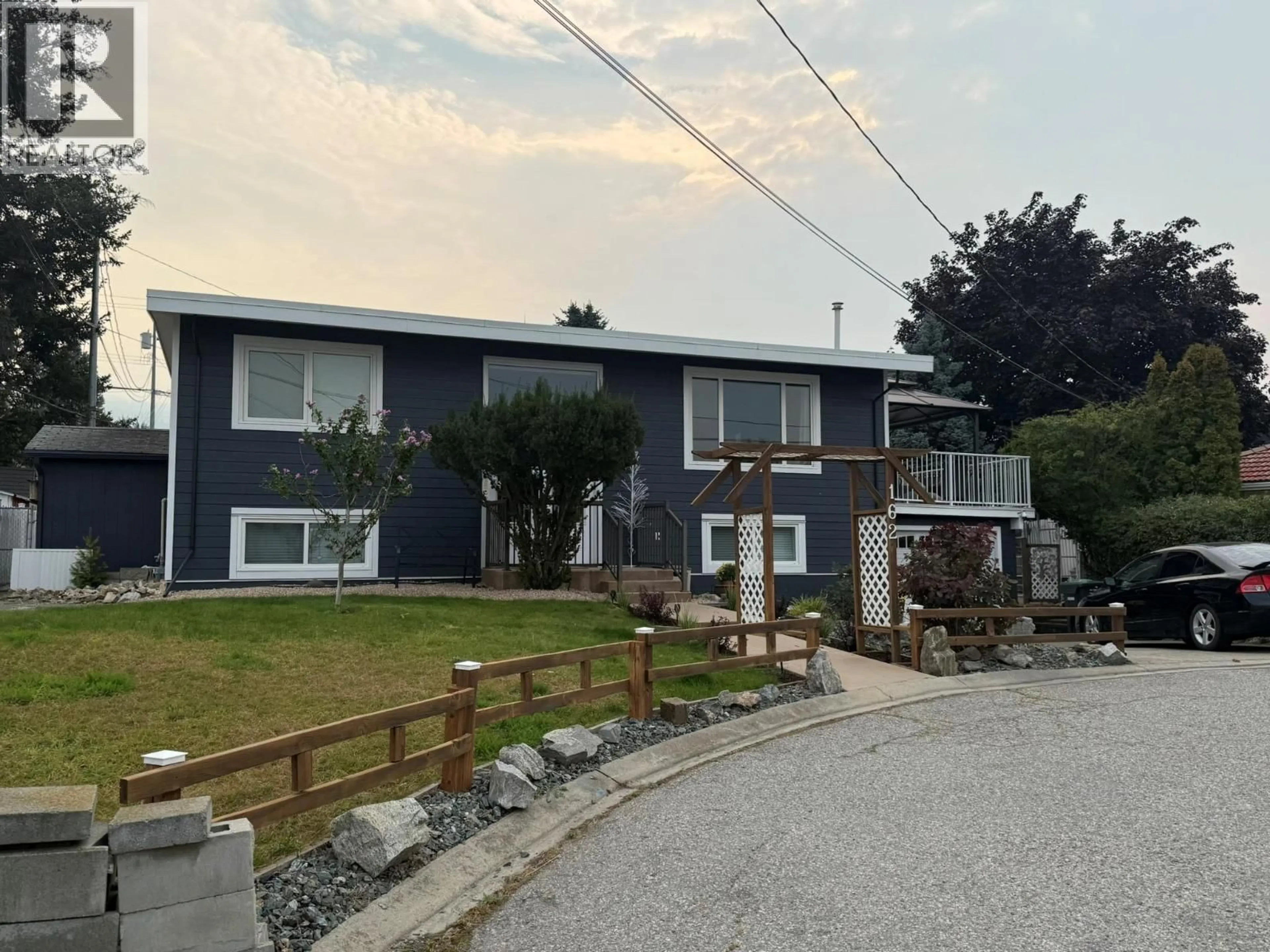 A pic from outside/outdoor area/front of a property/back of a property/a pic from drone, street for 162 DUNCAN PLACE, Penticton British Columbia V2A4B3