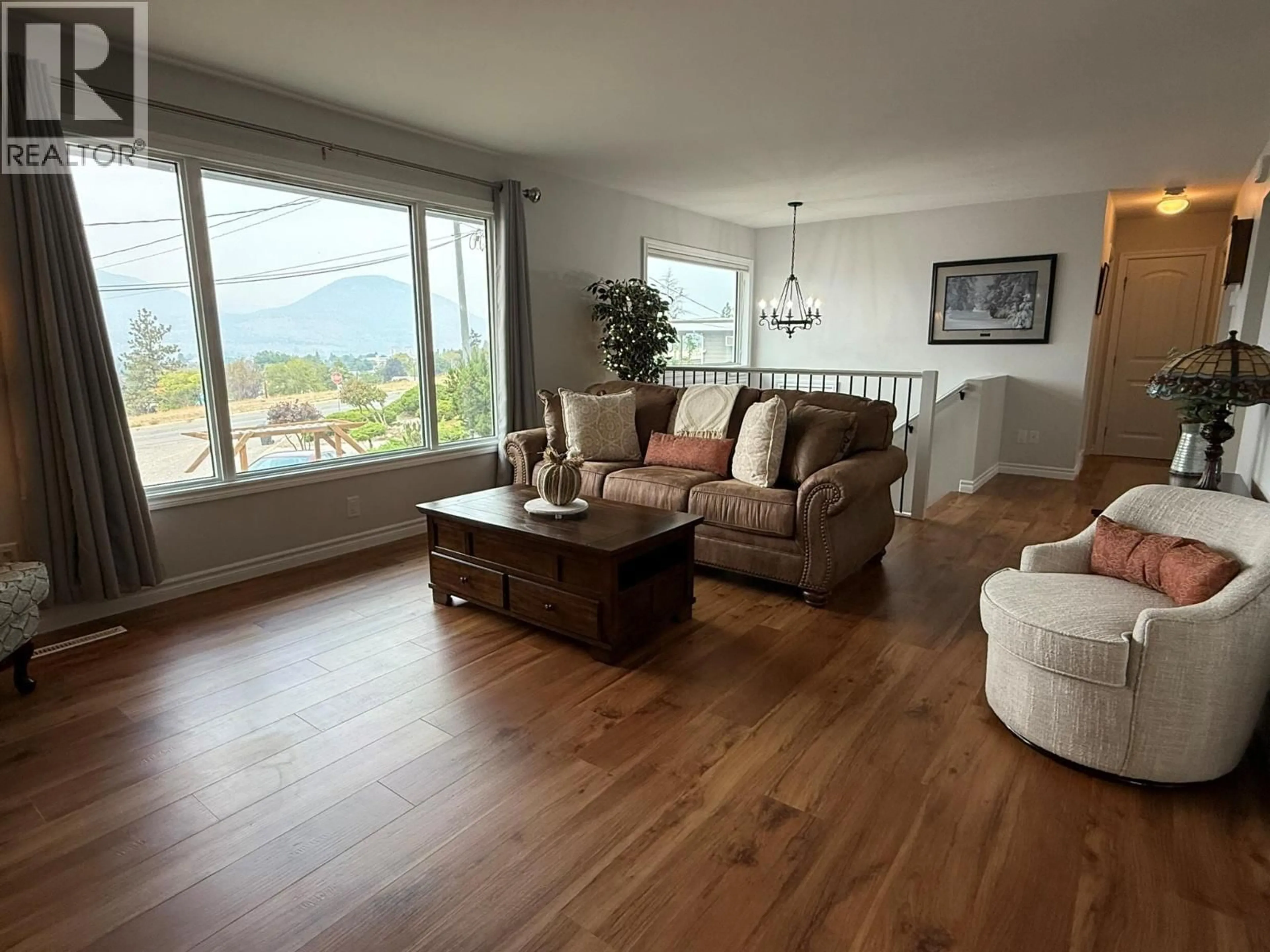 Living room with furniture, wood/laminate floor for 162 DUNCAN PLACE, Penticton British Columbia V2A4B3