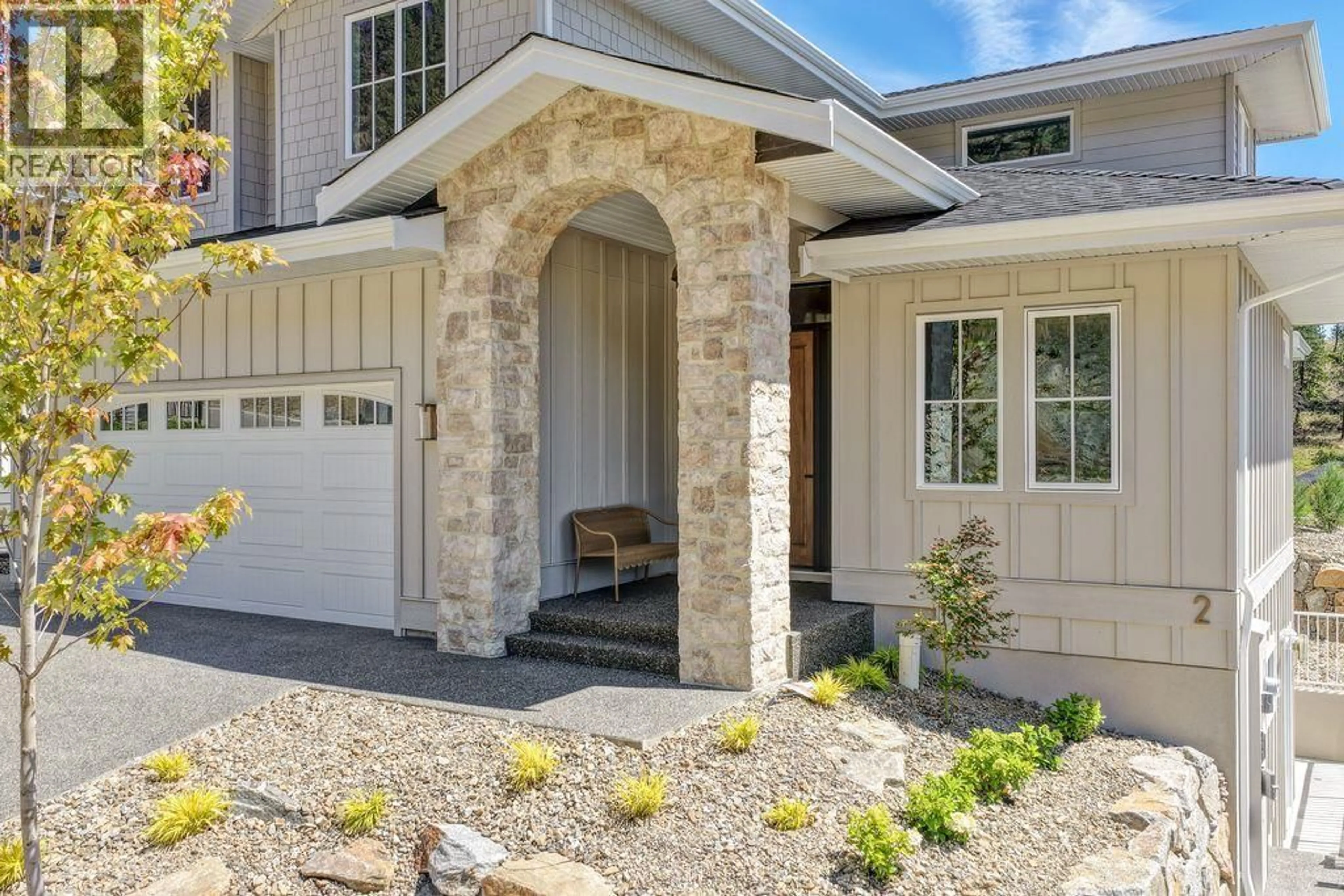 Home with brick exterior material, street for 1439 WHISTLING PINE PLACE, Kelowna British Columbia V1V2C6