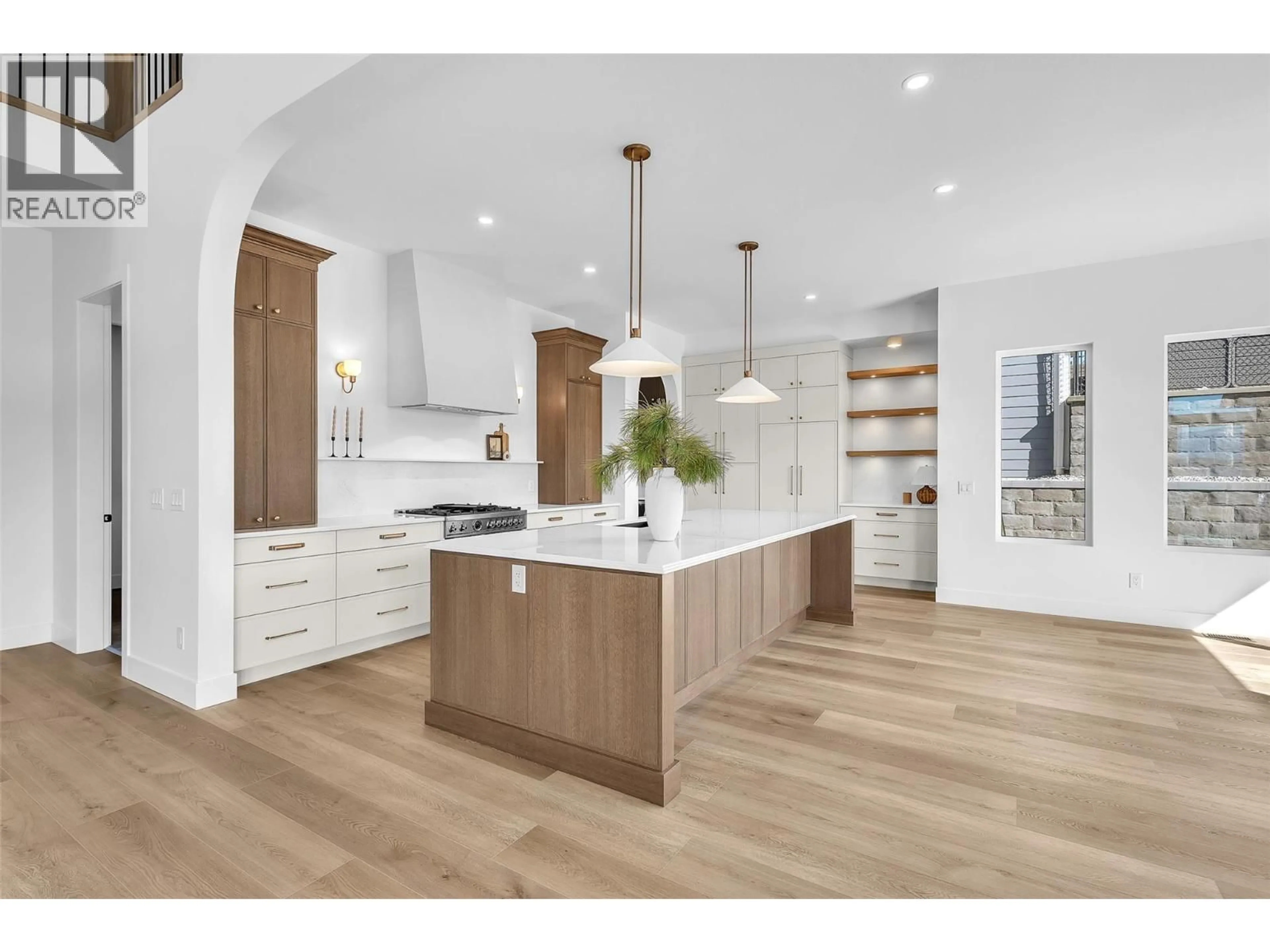 Open concept kitchen, wood/laminate floor for 1439 WHISTLING PINE PLACE, Kelowna British Columbia V1V2C6