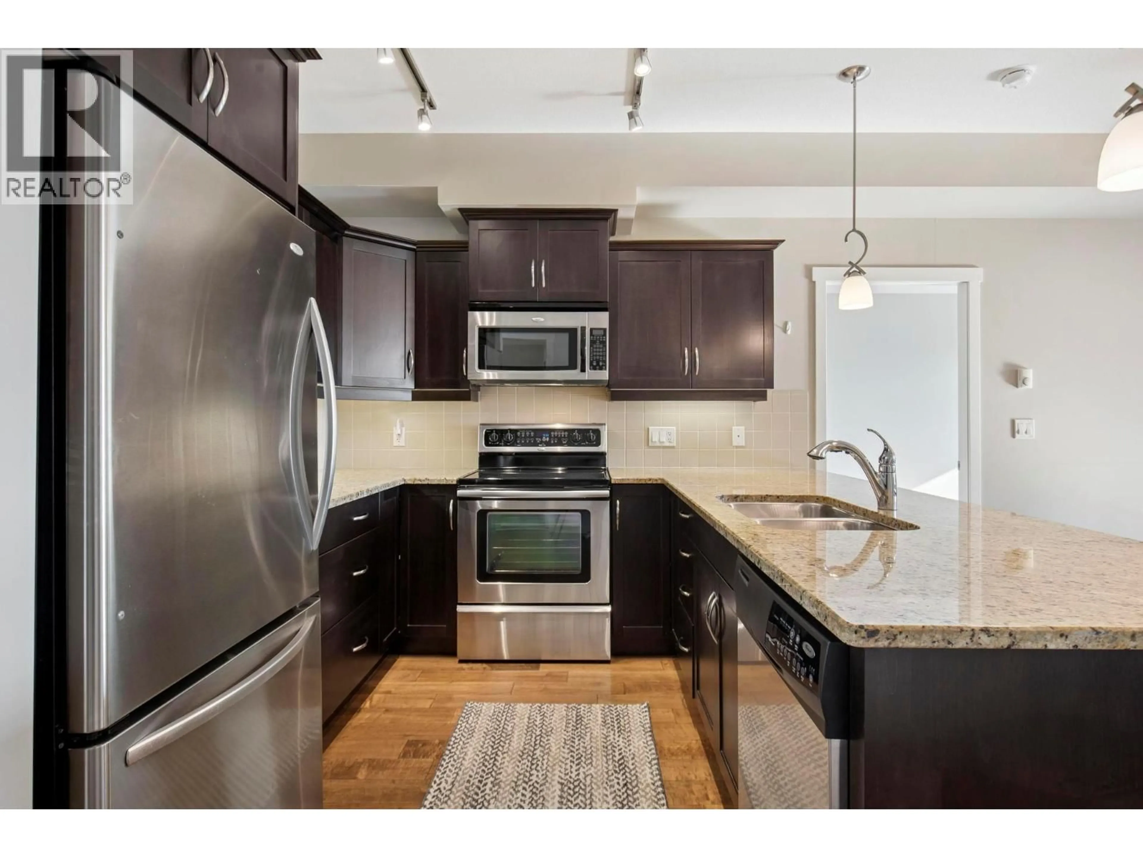 Open concept kitchen, unknown for 205 - 3735 CASORSO ROAD, Kelowna British Columbia V1W5G1