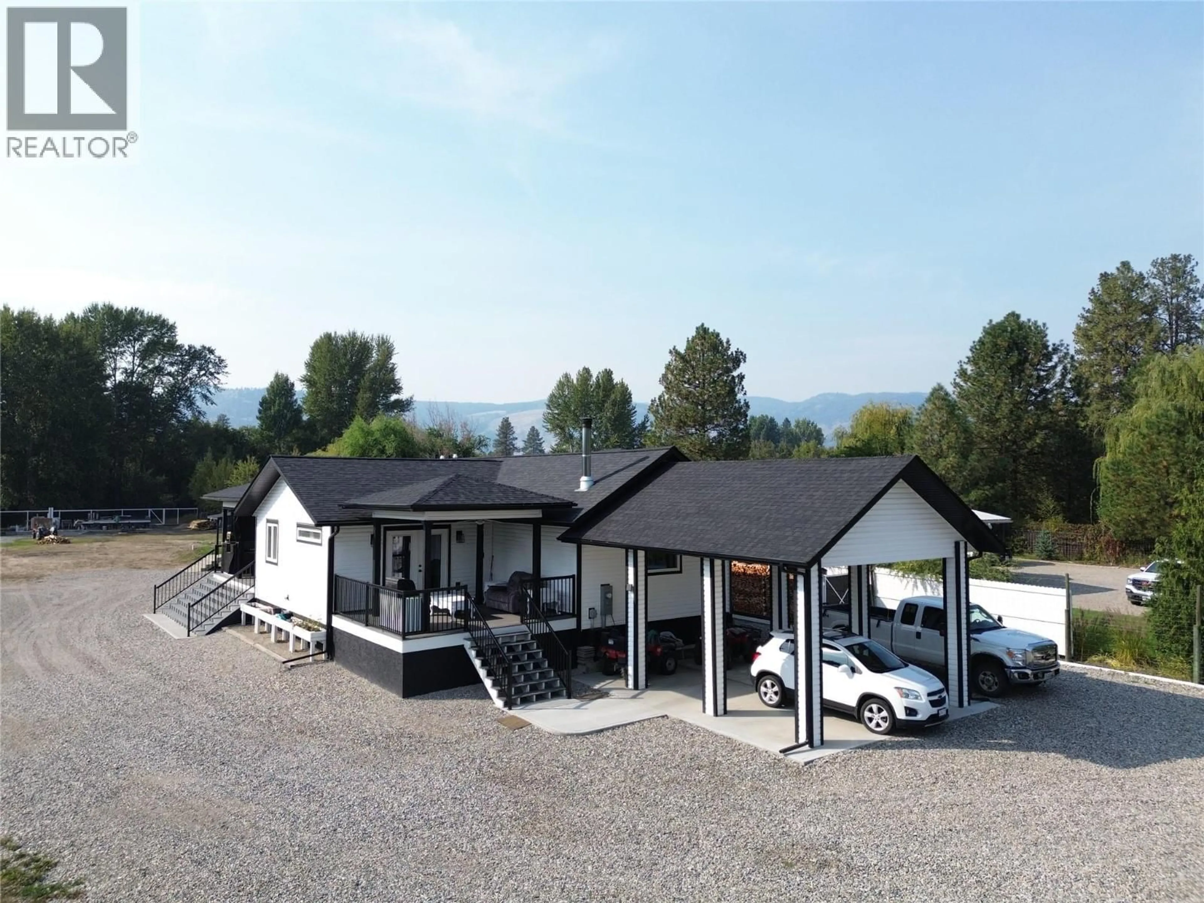 A pic from outside/outdoor area/front of a property/back of a property/a pic from drone, mountain view for 6135 12TH STREET, Grand Forks British Columbia V0H1H0