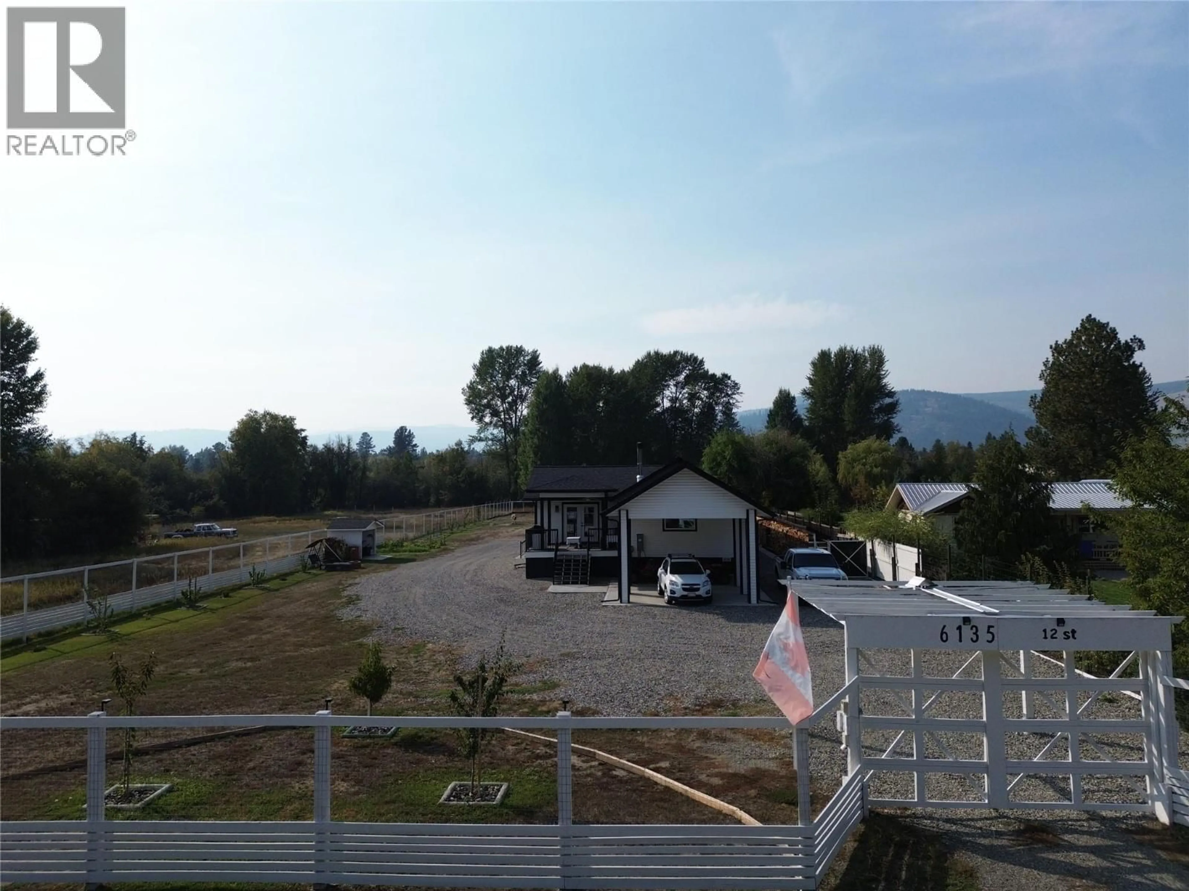 A pic from outside/outdoor area/front of a property/back of a property/a pic from drone, mountain view for 6135 12TH STREET, Grand Forks British Columbia V0H1H0