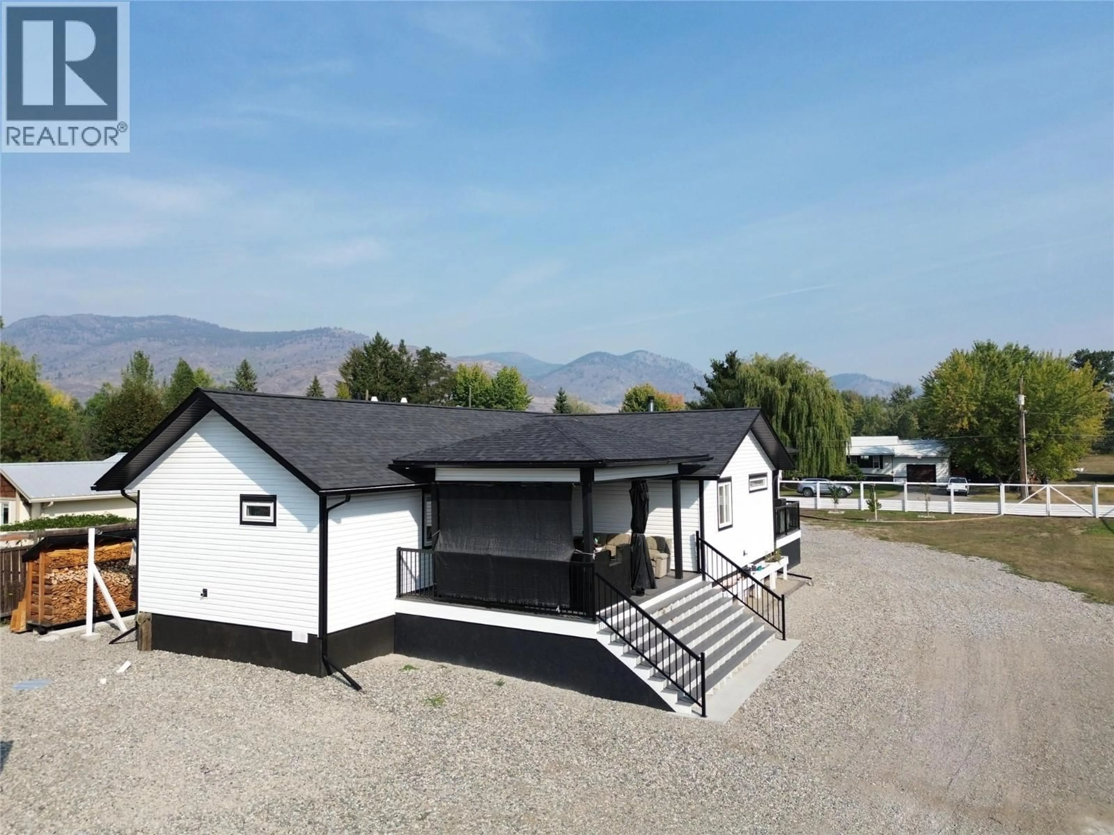 A pic from outside/outdoor area/front of a property/back of a property/a pic from drone, mountain view for 6135 12TH STREET, Grand Forks British Columbia V0H1H0