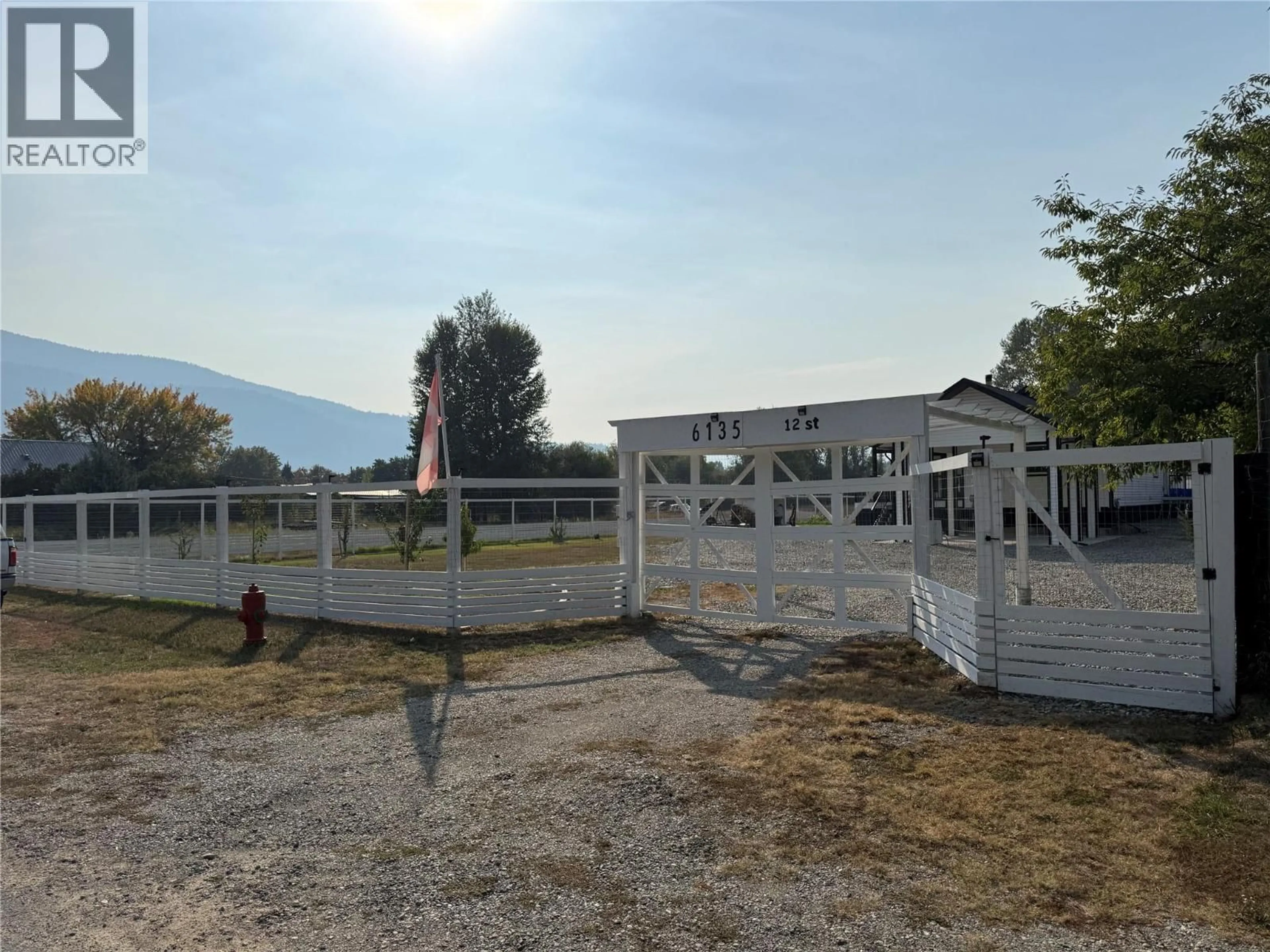 A pic from outside/outdoor area/front of a property/back of a property/a pic from drone, mountain view for 6135 12TH STREET, Grand Forks British Columbia V0H1H0