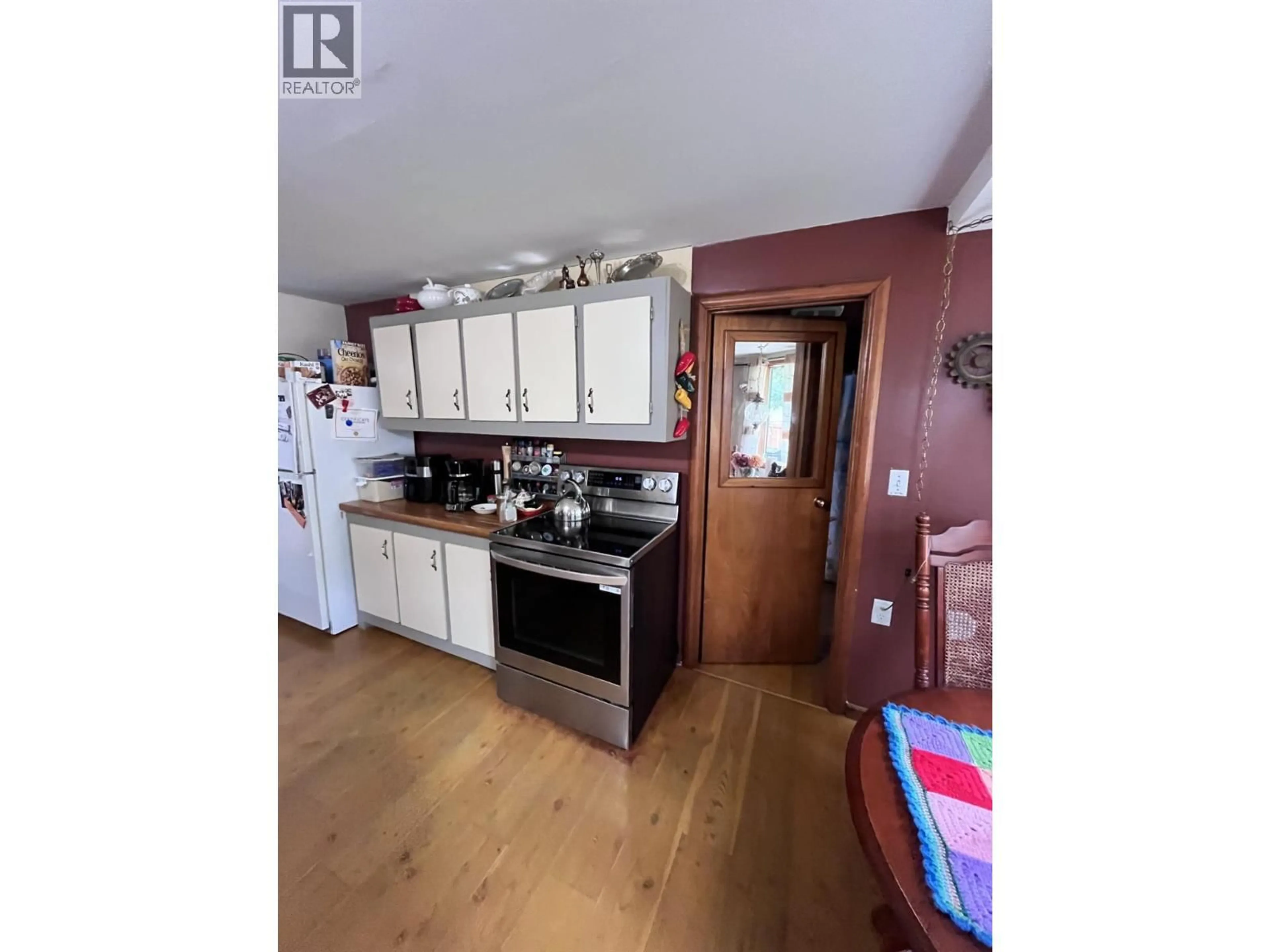 Open concept kitchen, wood/laminate floor for 709 2ND STREET, Castlegar British Columbia V1N1Y9
