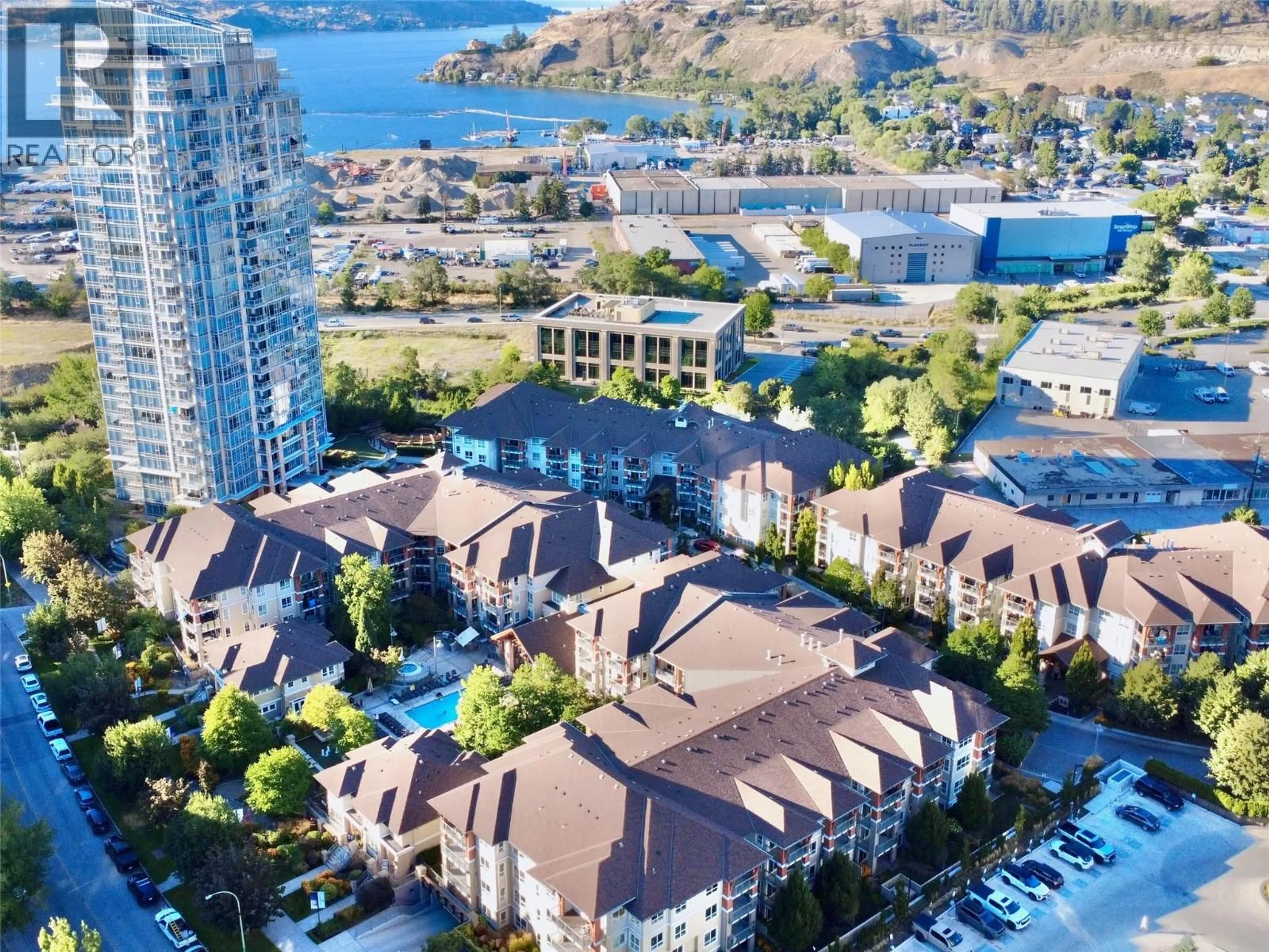 A pic from outside/outdoor area/front of a property/back of a property/a pic from drone, water/lake/river/ocean view for 105 - 1093 SUNSET DRIVE, Kelowna British Columbia V1Y9Z4