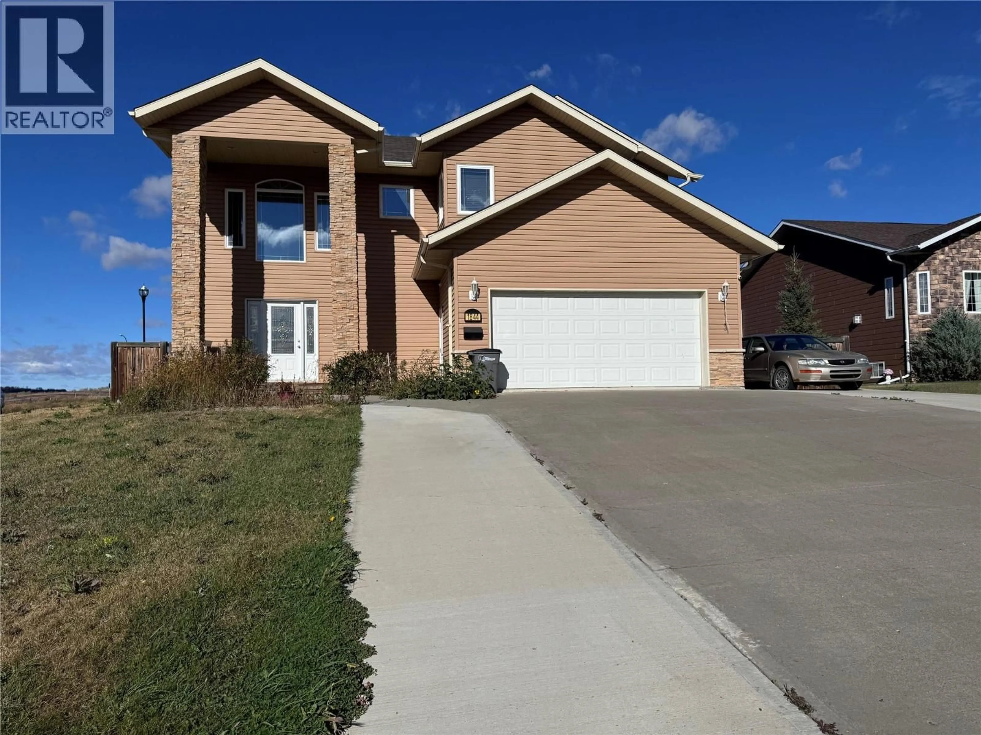 Home with brick exterior material, street for 1844 87 AVENUE, Dawson Creek British Columbia V1G0B5