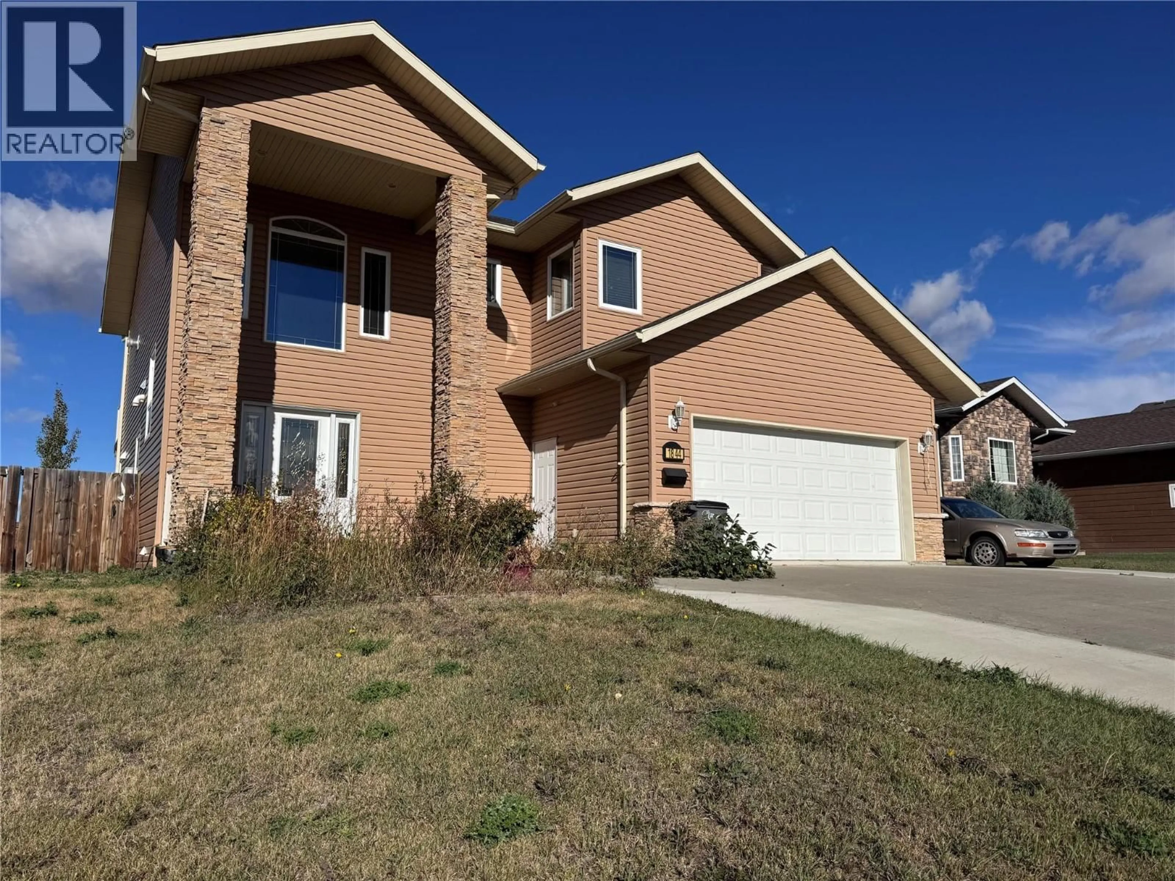 Home with brick exterior material, street for 1844 87 AVENUE, Dawson Creek British Columbia V1G0B5