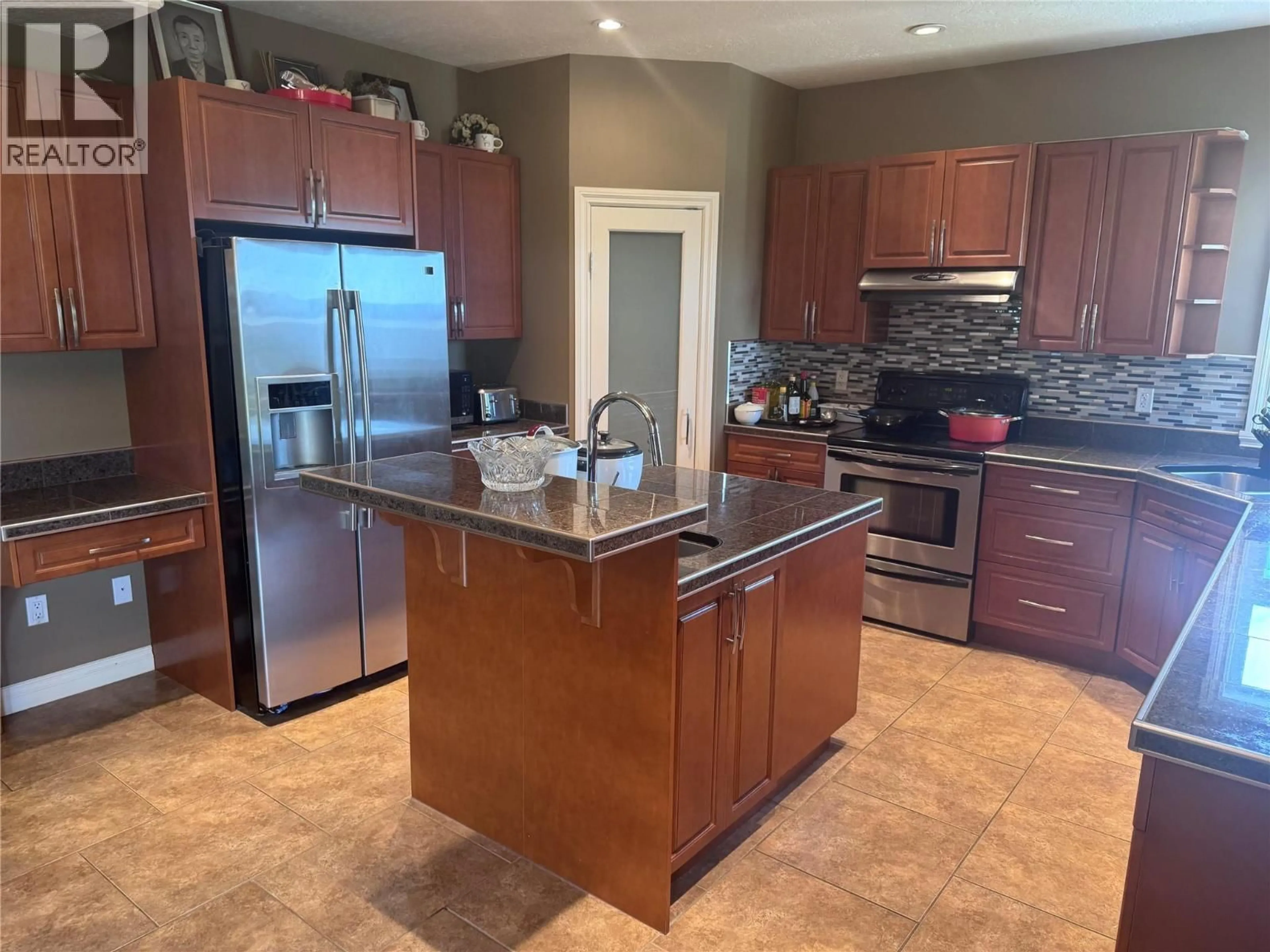 Open concept kitchen, ceramic/tile floor for 1844 87 AVENUE, Dawson Creek British Columbia V1G0B5