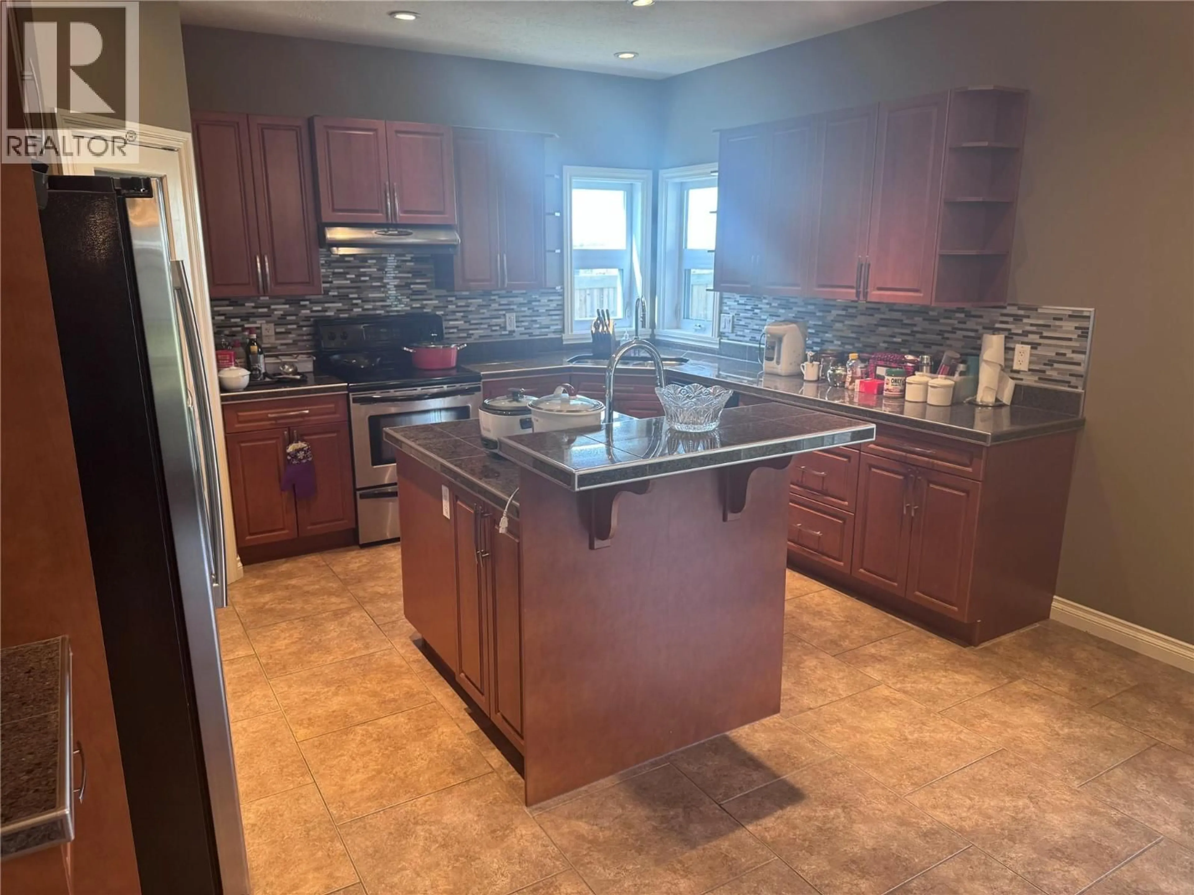 Open concept kitchen, ceramic/tile floor for 1844 87 AVENUE, Dawson Creek British Columbia V1G0B5