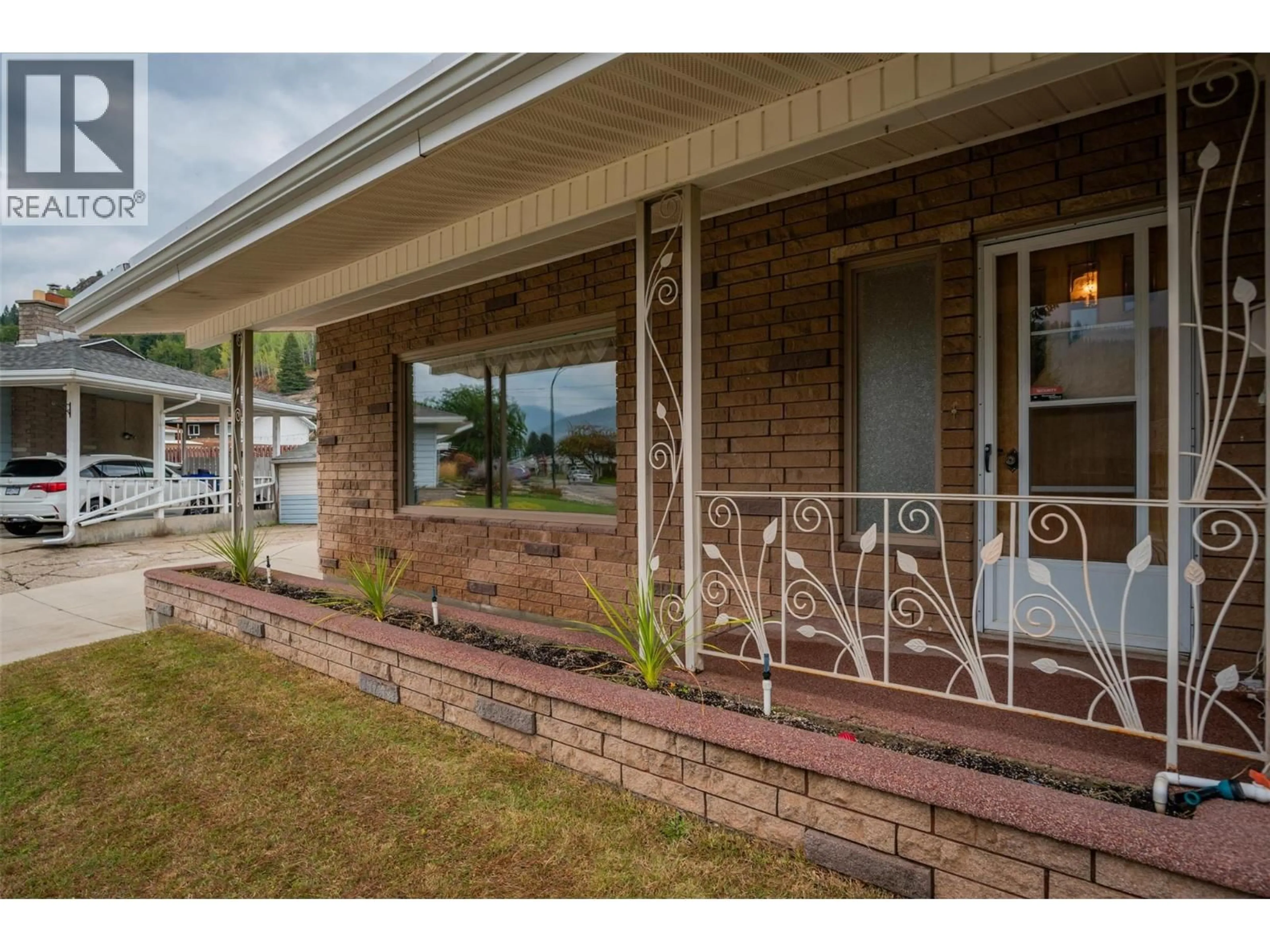 Home with brick exterior material, water/lake/river/ocean view for 3581 ASTER DRIVE, Trail British Columbia V1R2X4