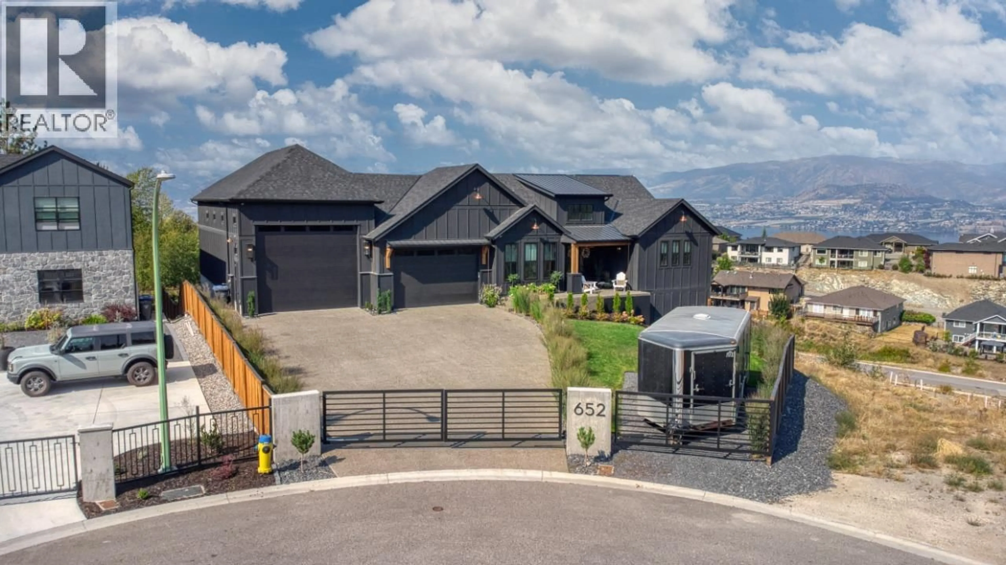 A pic from outside/outdoor area/front of a property/back of a property/a pic from drone, mountain view for 652 TRUMPETER ROAD, Kelowna British Columbia V1W4L6