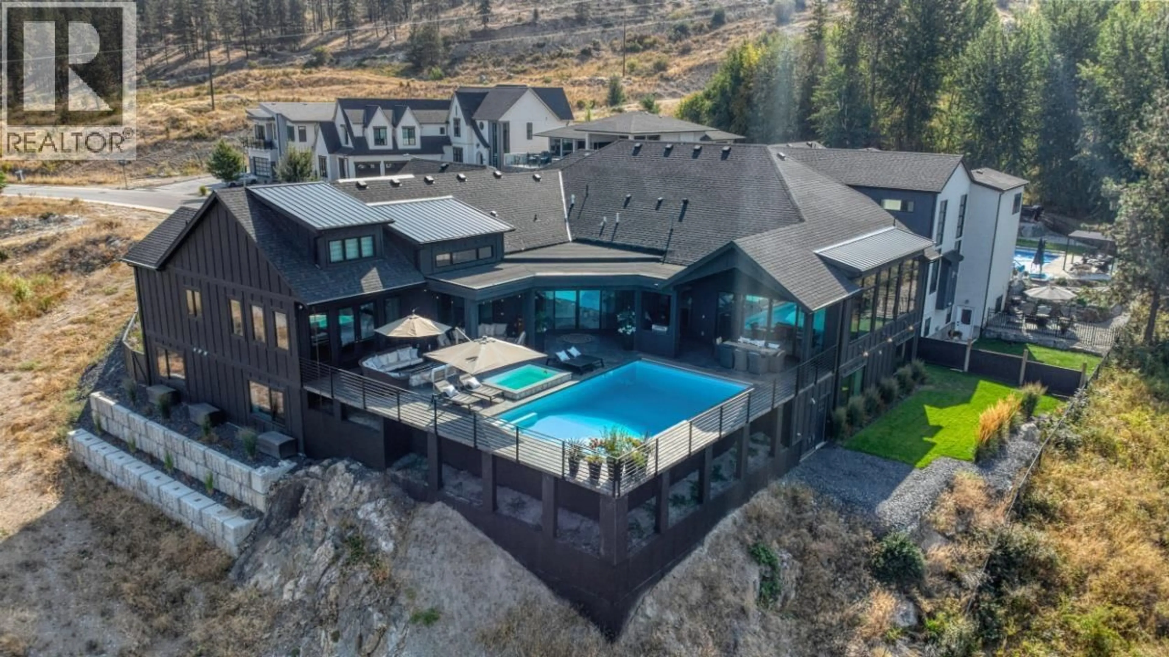 A pic from outside/outdoor area/front of a property/back of a property/a pic from drone, mountain view for 652 TRUMPETER ROAD, Kelowna British Columbia V1W4L6