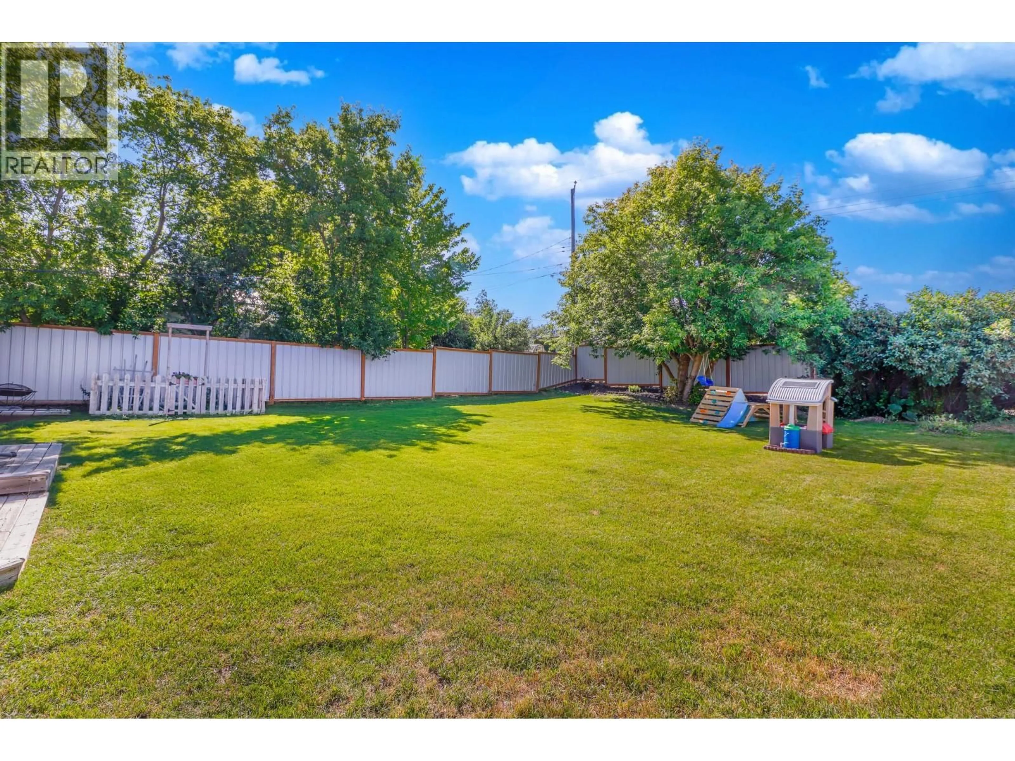 A pic from outside/outdoor area/front of a property/back of a property/a pic from drone, water/lake/river/ocean view for 901 5A STREET SOUTH, Cranbrook British Columbia V1C1K7