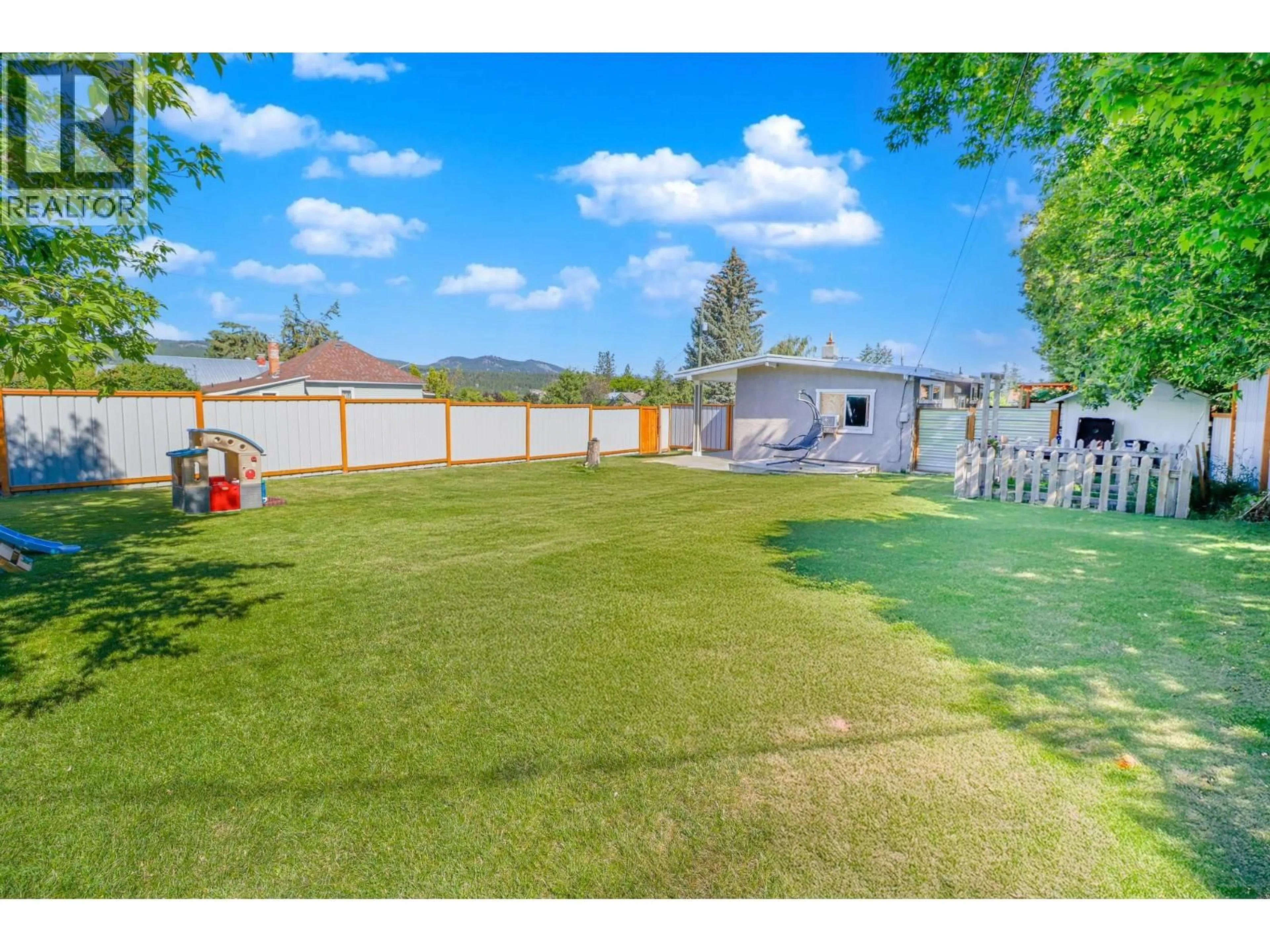 A pic from outside/outdoor area/front of a property/back of a property/a pic from drone, mountain view for 901 5A STREET SOUTH, Cranbrook British Columbia V1C1K7