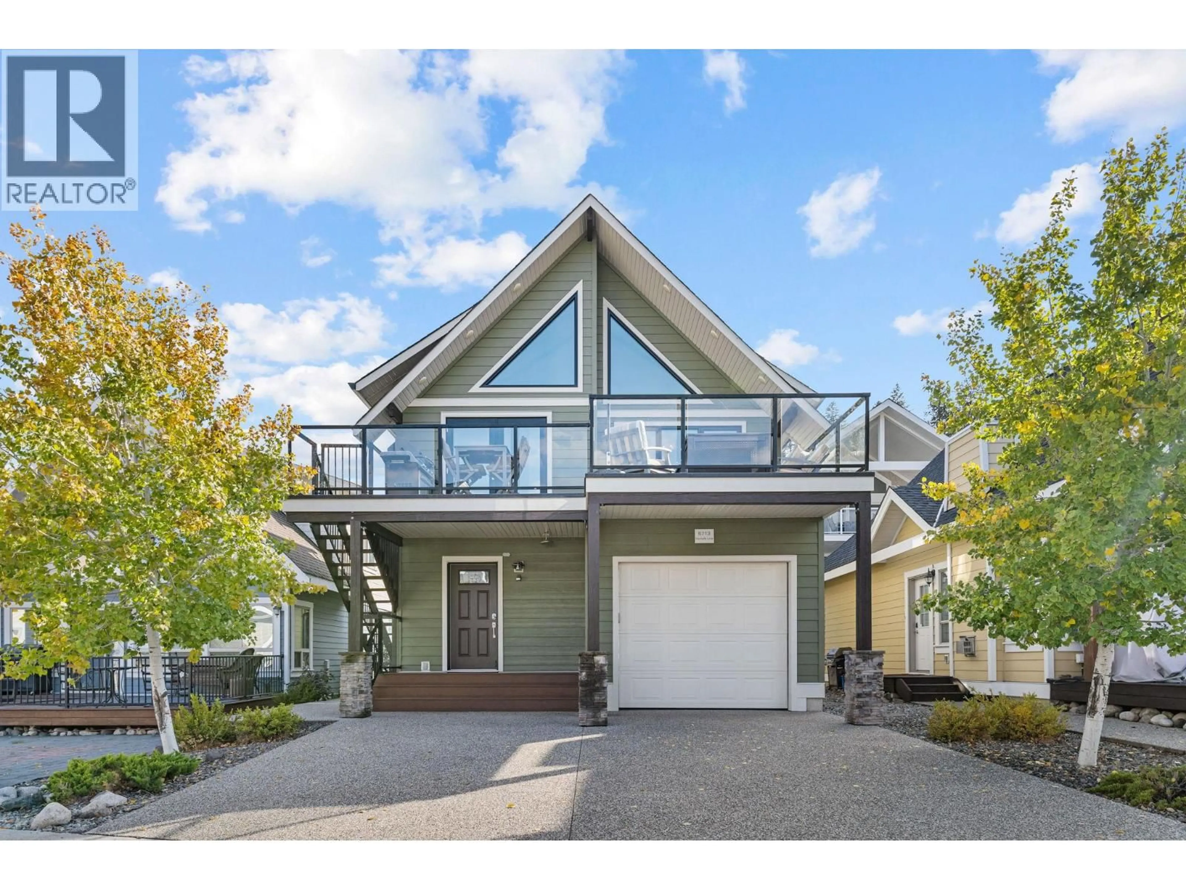 Home with vinyl exterior material, street for 6713 MARBELLA LOOP, Kelowna British Columbia V1Z3R8