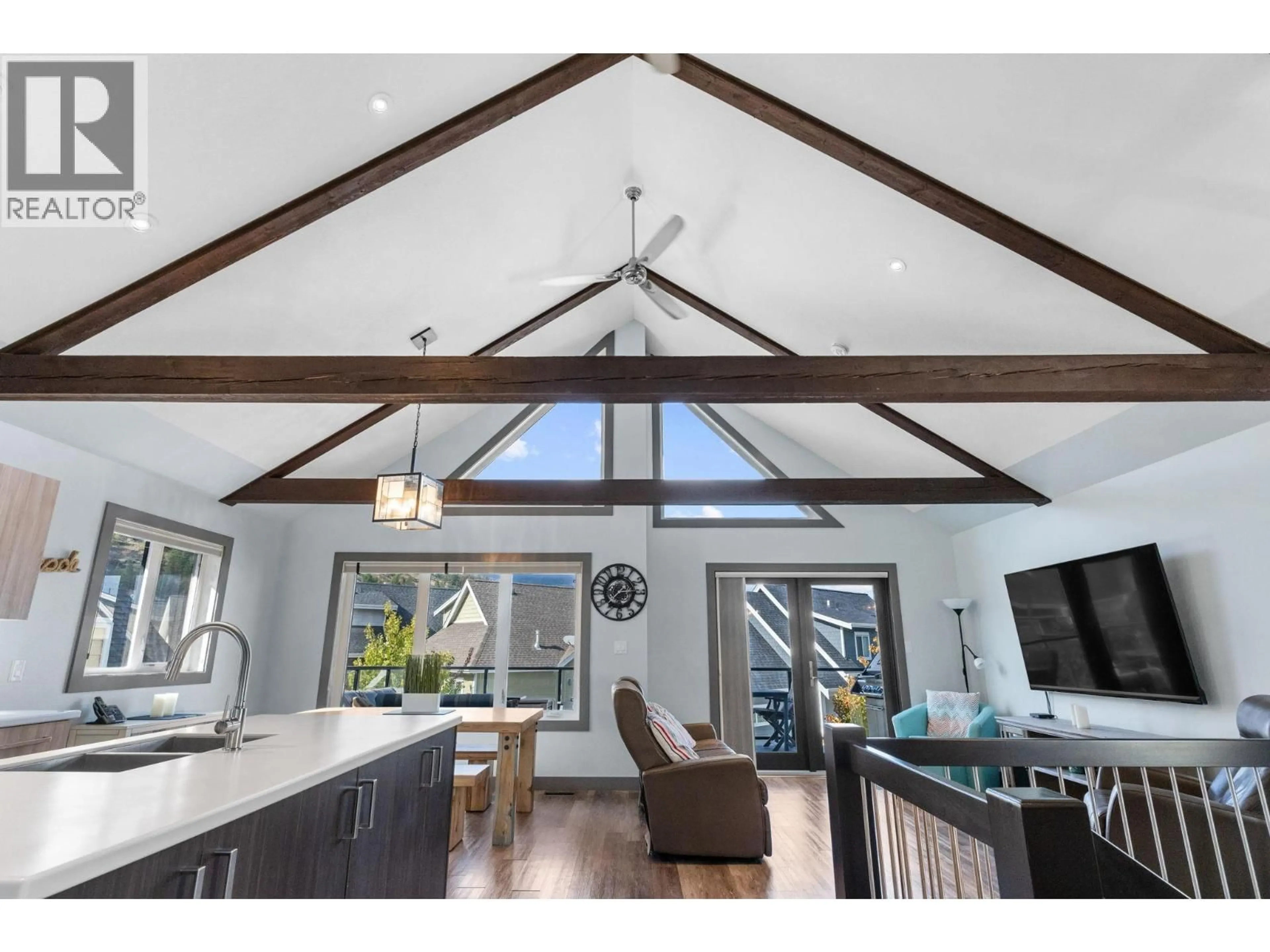 Open concept kitchen, wood/laminate floor for 6713 MARBELLA LOOP, Kelowna British Columbia V1Z3R8