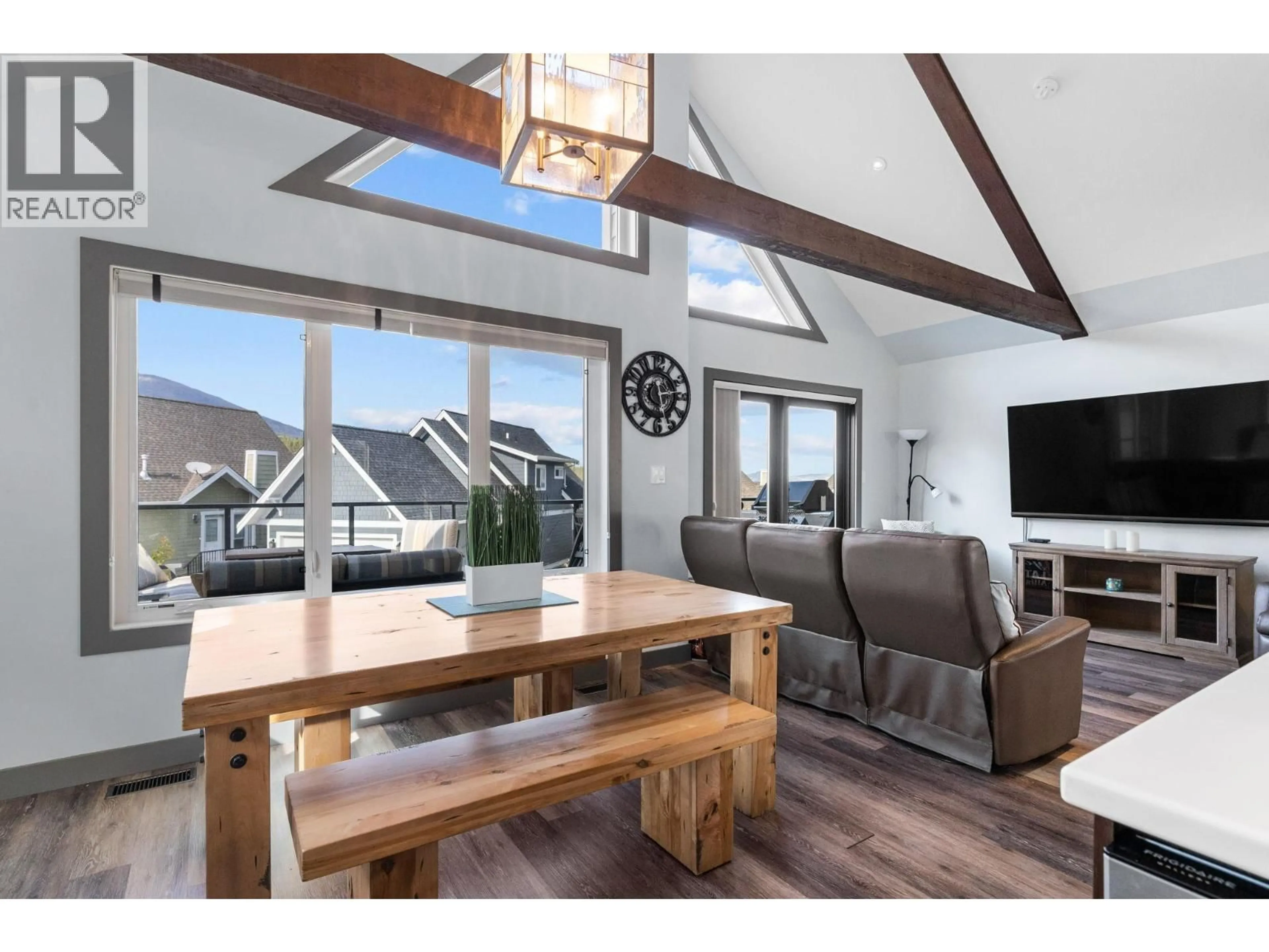 Open concept kitchen, wood/laminate floor for 6713 MARBELLA LOOP, Kelowna British Columbia V1Z3R8