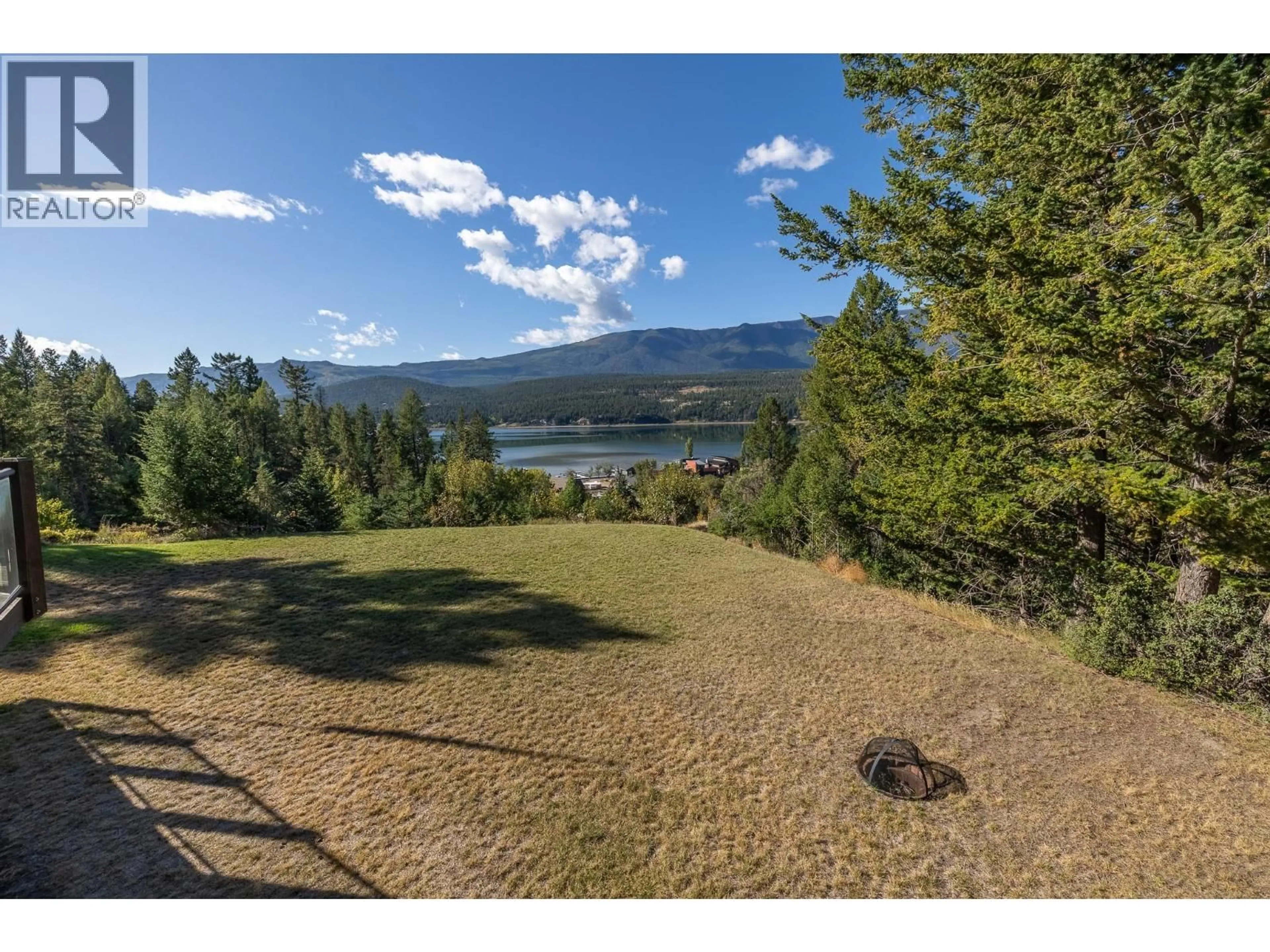A pic from outside/outdoor area/front of a property/back of a property/a pic from drone, water/lake/river/ocean view for 4721 WILMAI ROAD, Windermere British Columbia V0B2L2