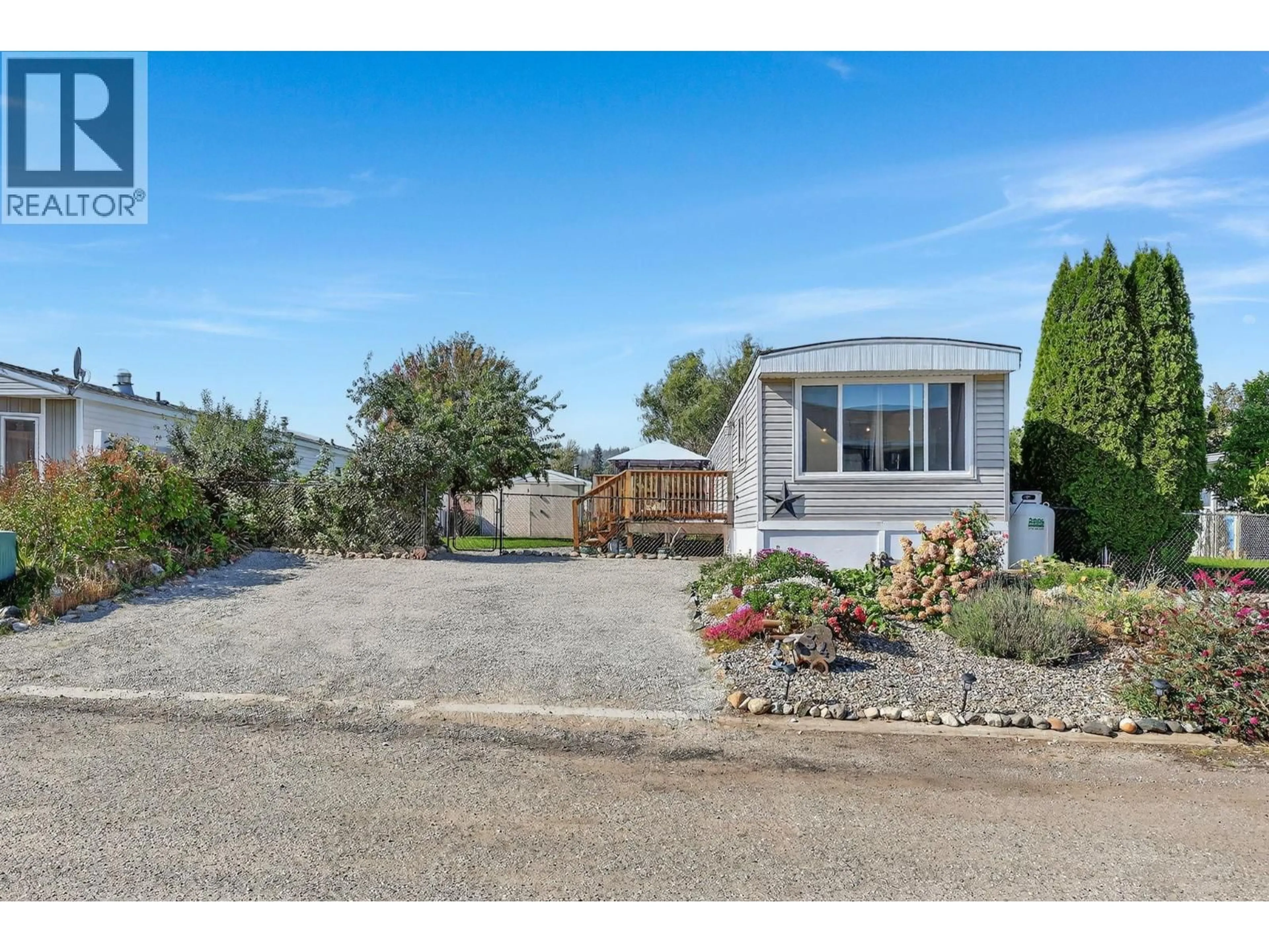 A pic from outside/outdoor area/front of a property/back of a property/a pic from drone, street for 34 - 8945 HWY 97N OTHER, Kelowna British Columbia V4V1E8