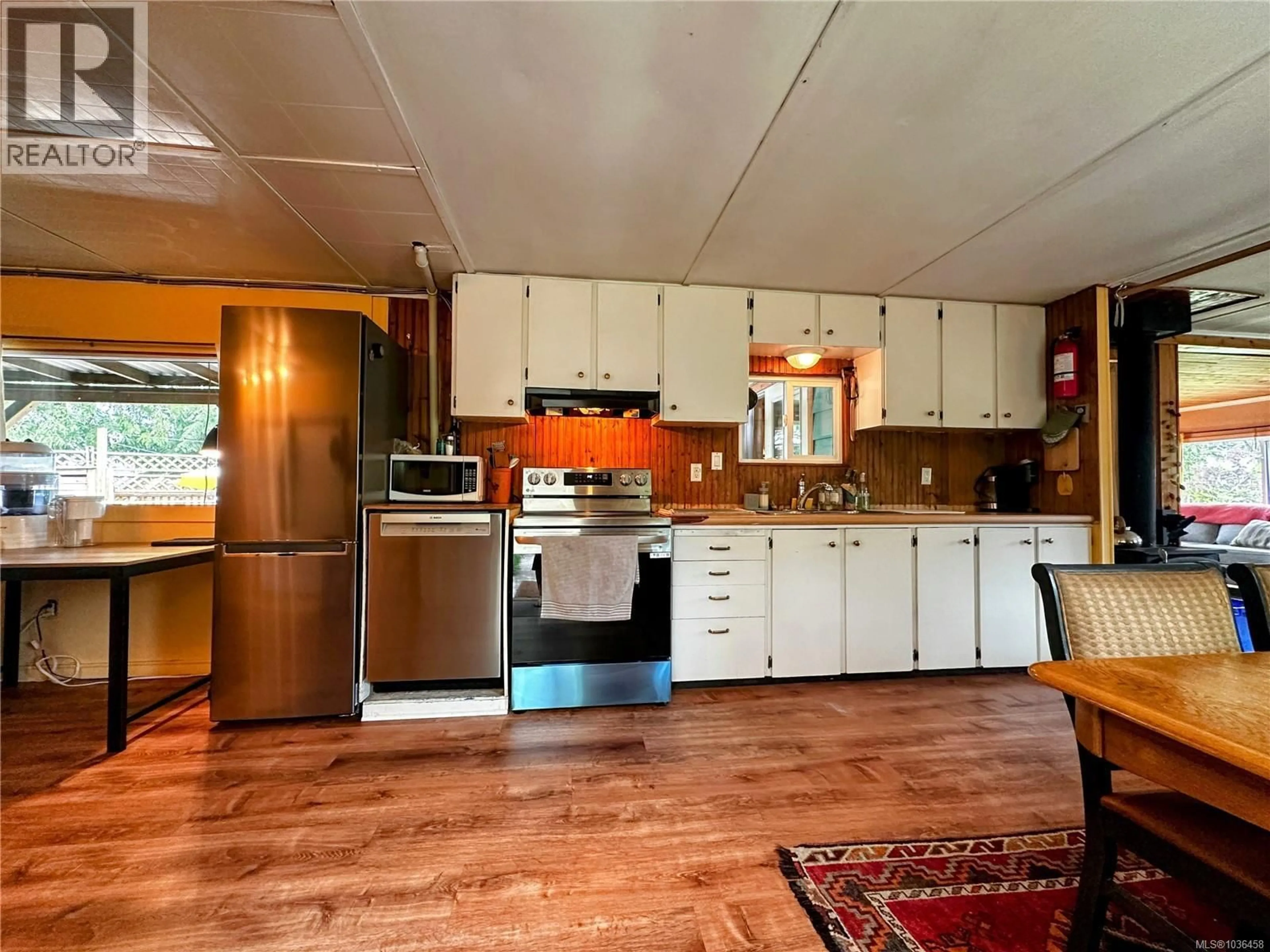 Open concept kitchen, wood/laminate floor for 5097 GROUHEL ROAD, Ladysmith British Columbia V9G1J4
