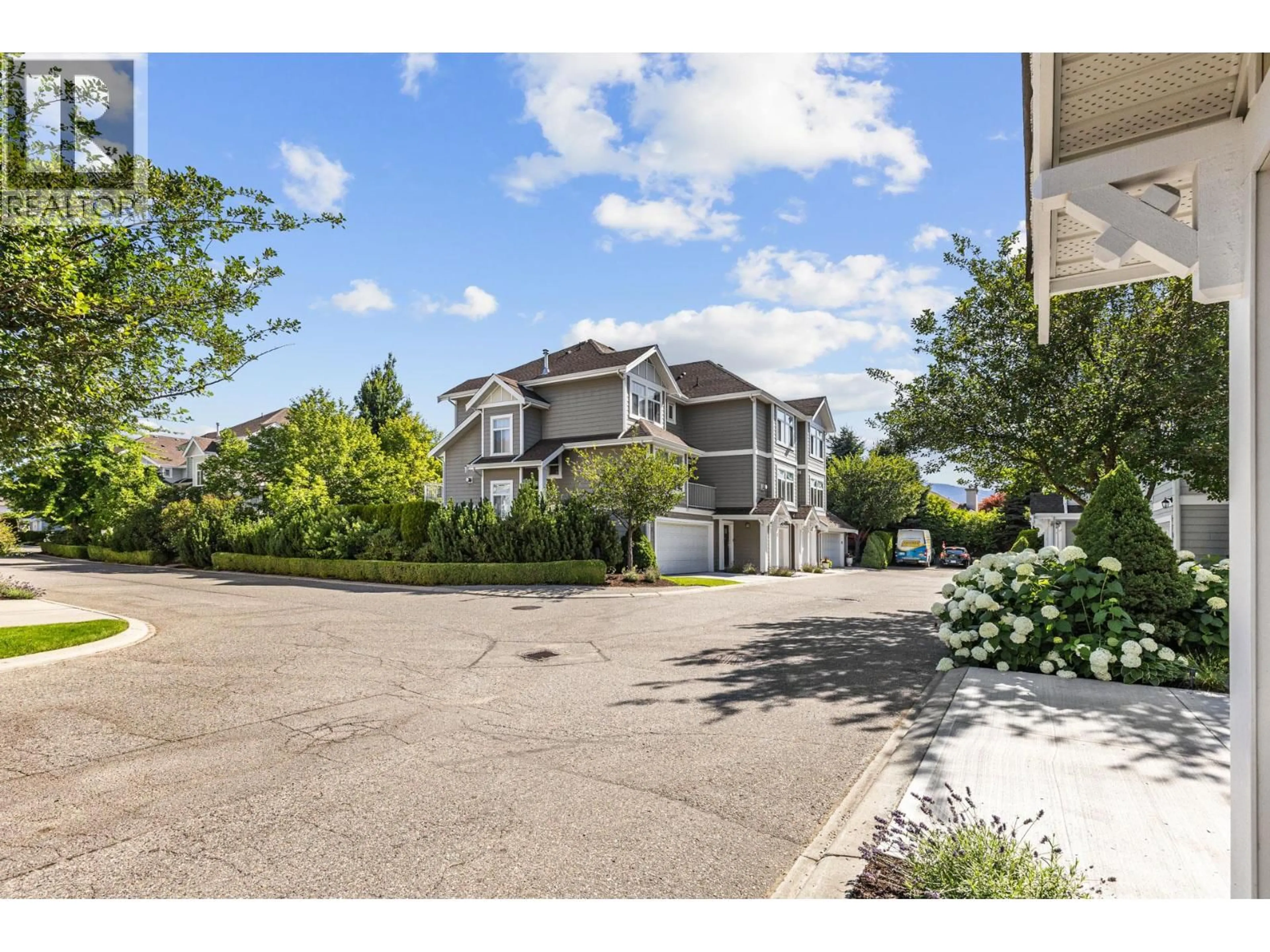 A pic from outside/outdoor area/front of a property/back of a property/a pic from drone, street for 14 - 1853 PARKVIEW CRESCENT, Kelowna British Columbia V1X8A3