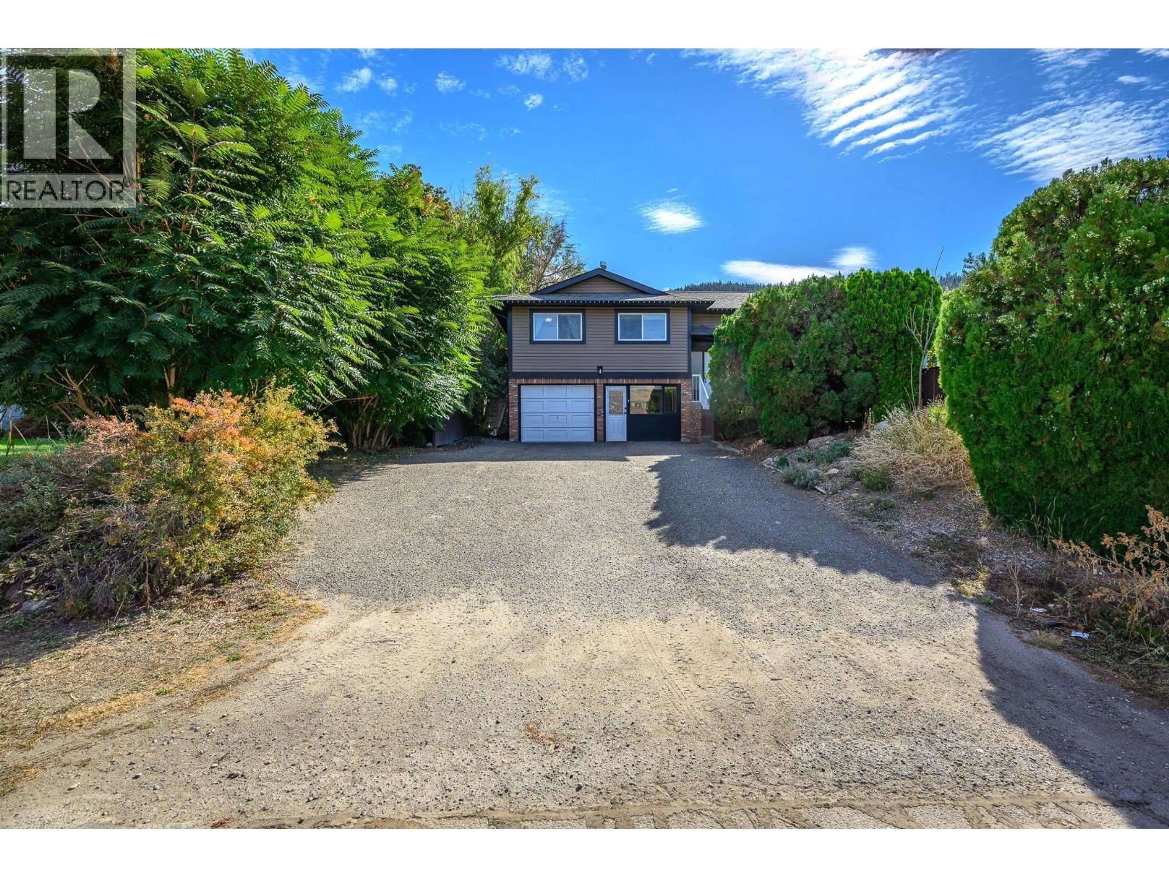 A pic from outside/outdoor area/front of a property/back of a property/a pic from drone, street for 7590 KLINGER ROAD, Vernon British Columbia V1H1H4