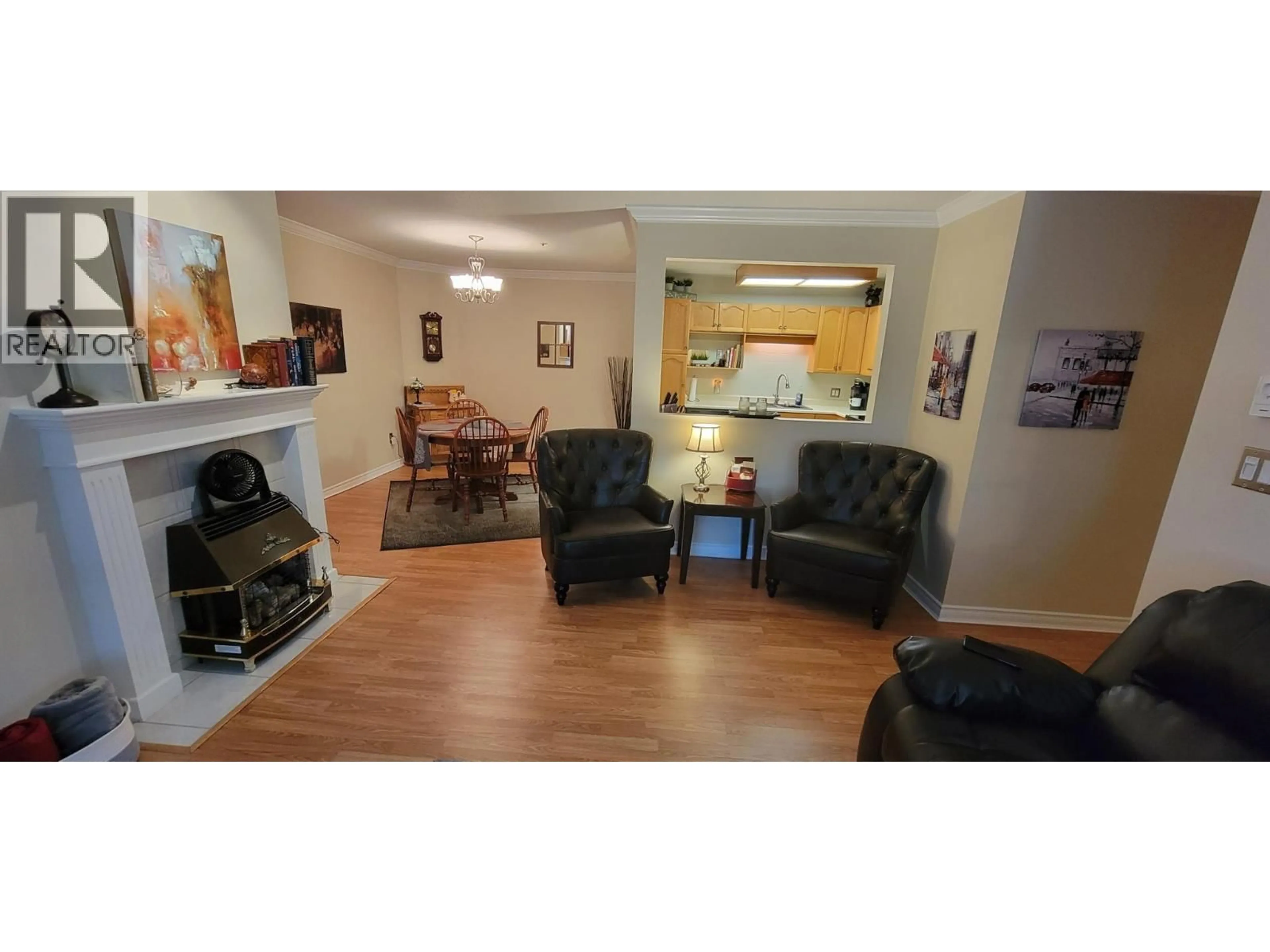 Living room with furniture, wood/laminate floor for 311 - 1445 HALIFAX STREET, Penticton British Columbia V2A8M8