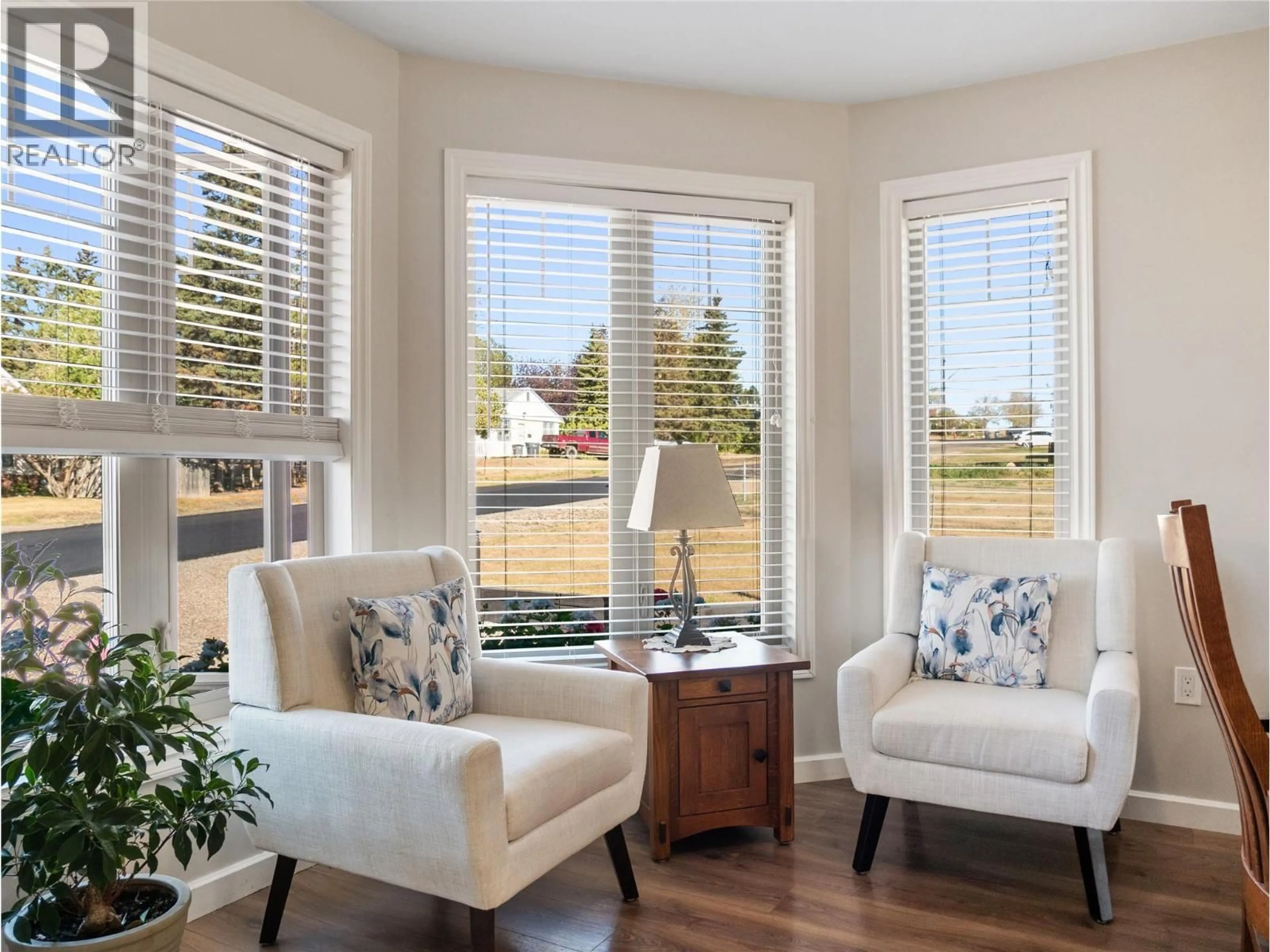 Living room with furniture, wood/laminate floor for 705 97A AVENUE, Dawson Creek British Columbia V1G1R2