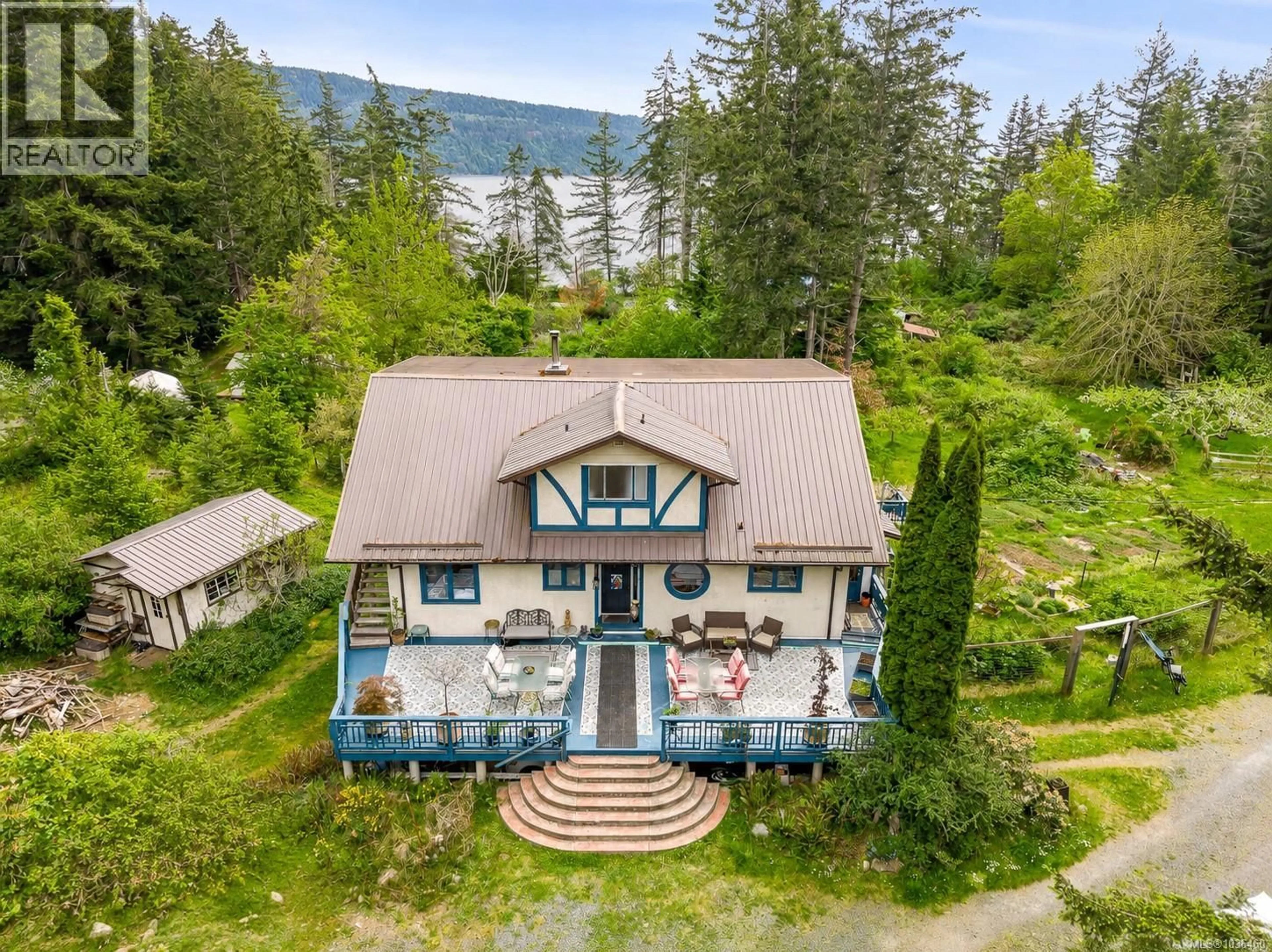 A pic from outside/outdoor area/front of a property/back of a property/a pic from drone, water/lake/river/ocean view for 9510 MCFARLANE ROAD, Denman Island British Columbia V0R1T0