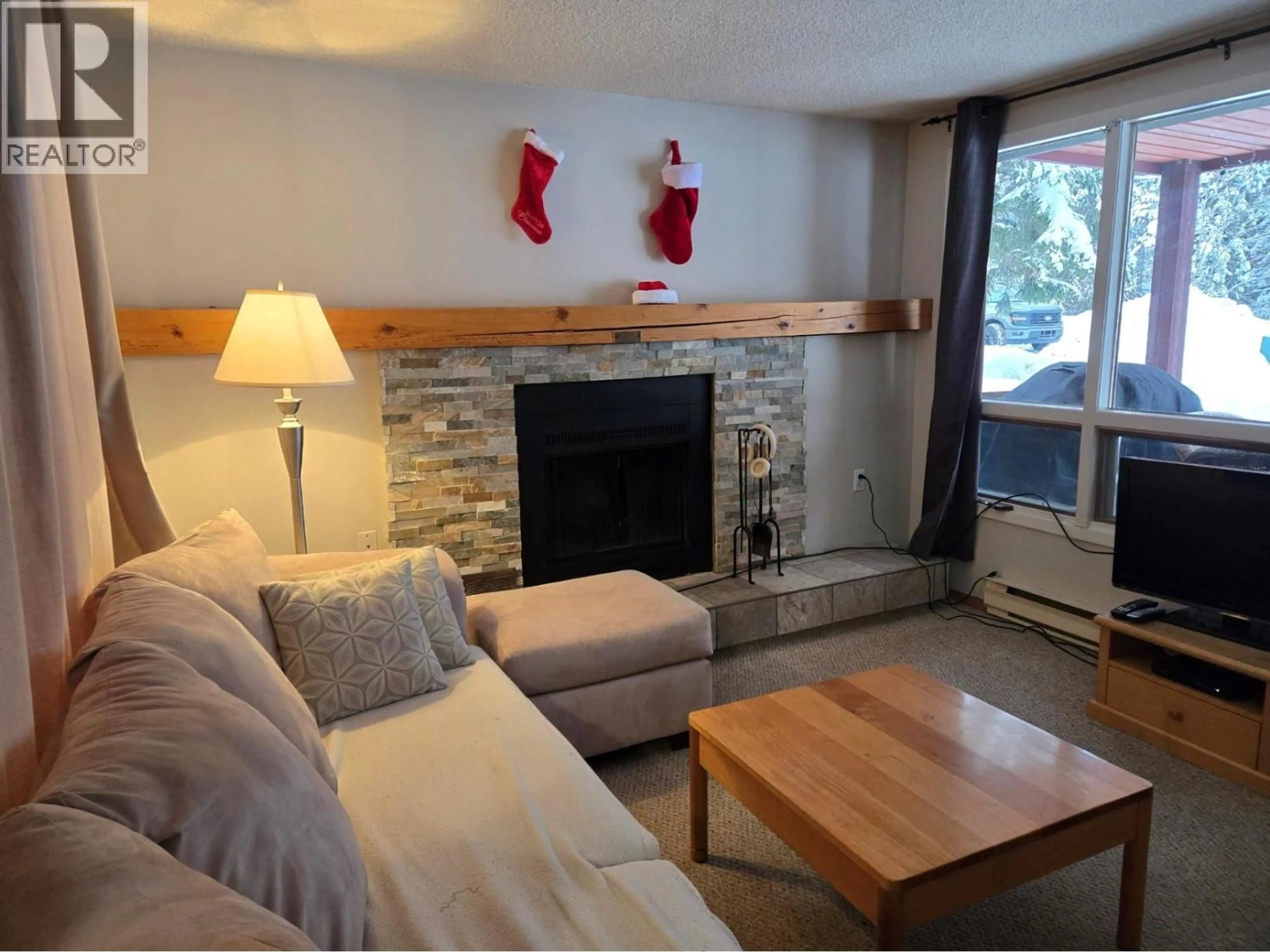 Living room with furniture, wood/laminate floor for 714 - 2030 PANORAMA DRIVE, Panorama British Columbia V0A1T0
