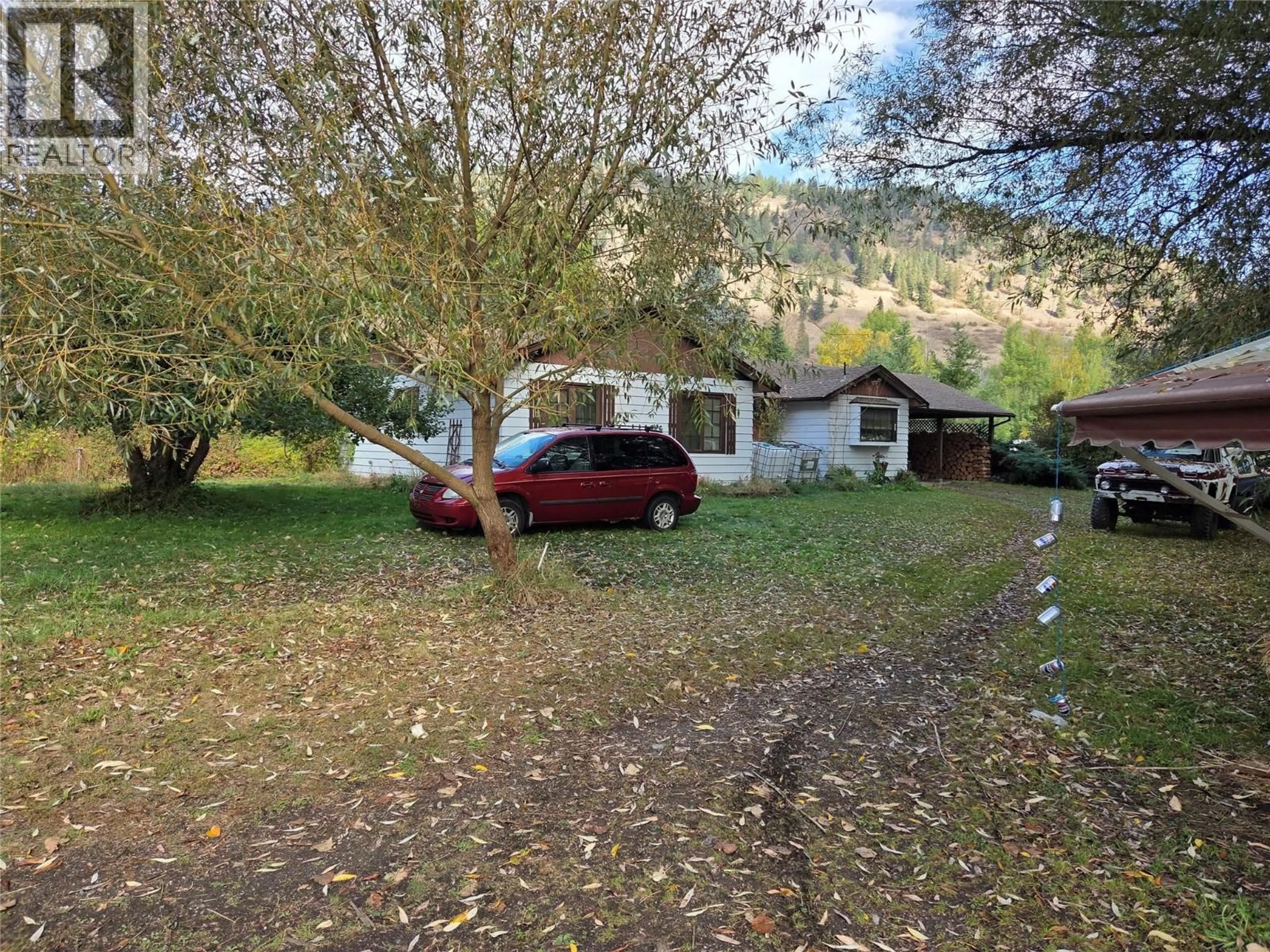 A pic from outside/outdoor area/front of a property/back of a property/a pic from drone, unknown for 26 BARNES ROAD, Lumby British Columbia V0E2G7