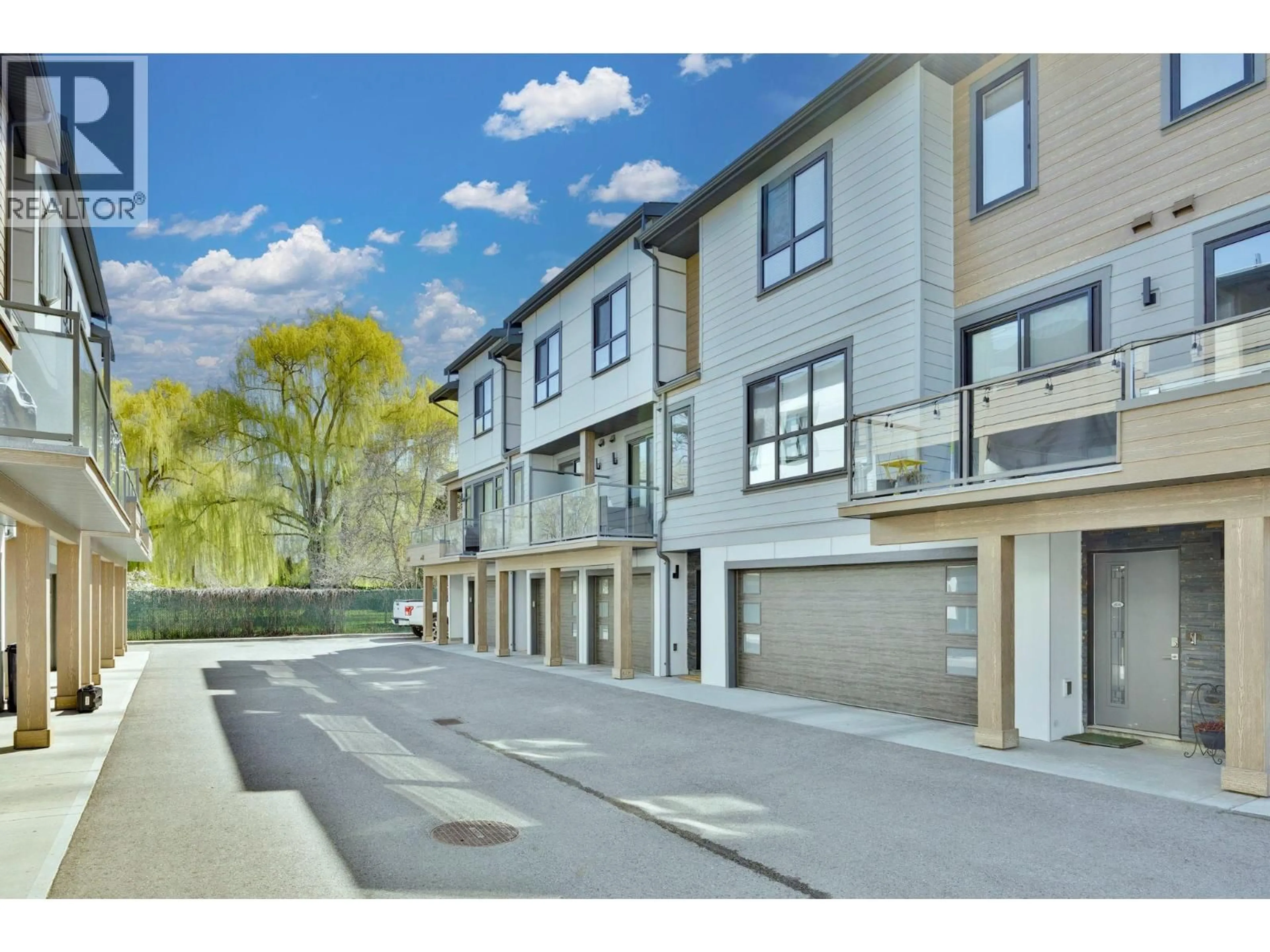 A pic from outside/outdoor area/front of a property/back of a property/a pic from drone, street for 403 - 11581 ROGERS ROAD, Lake Country British Columbia V4V1X8