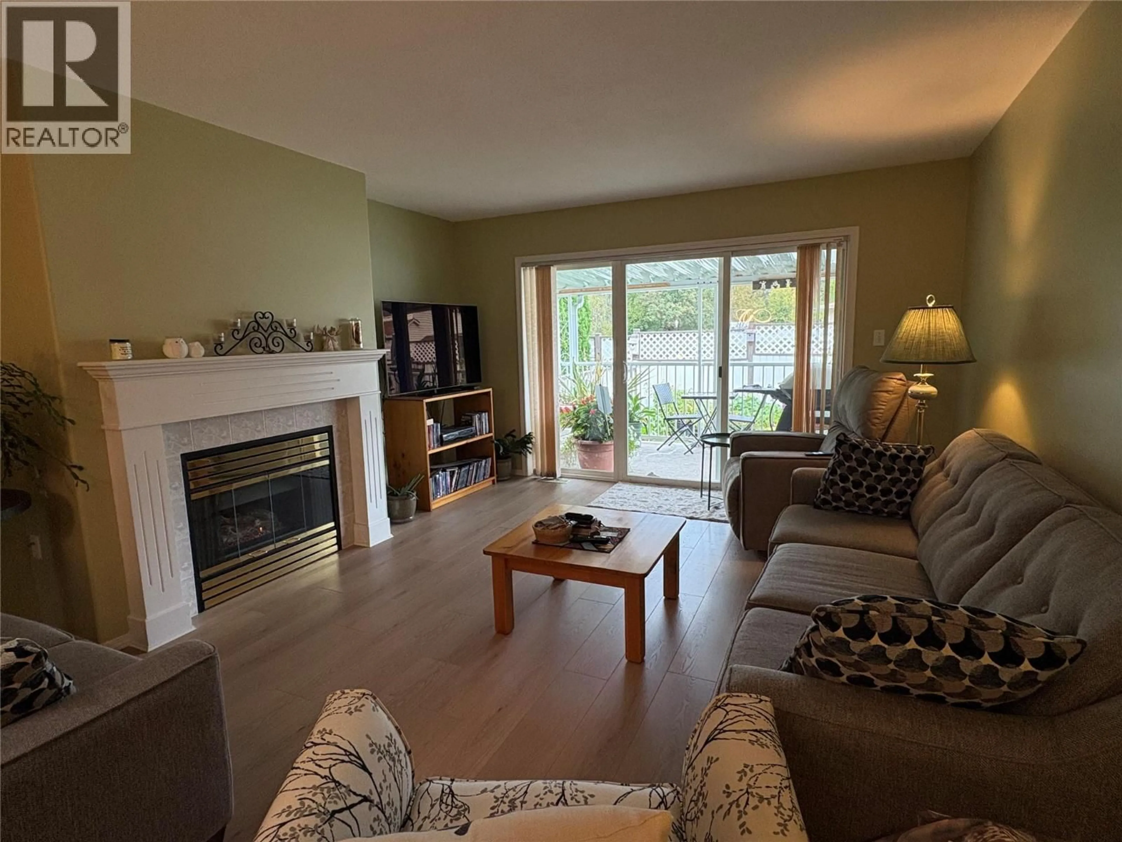 Living room with furniture, wood/laminate floor for 45 - 2210 COLUMBIA AVENUE, Castlegar British Columbia V1N2X1