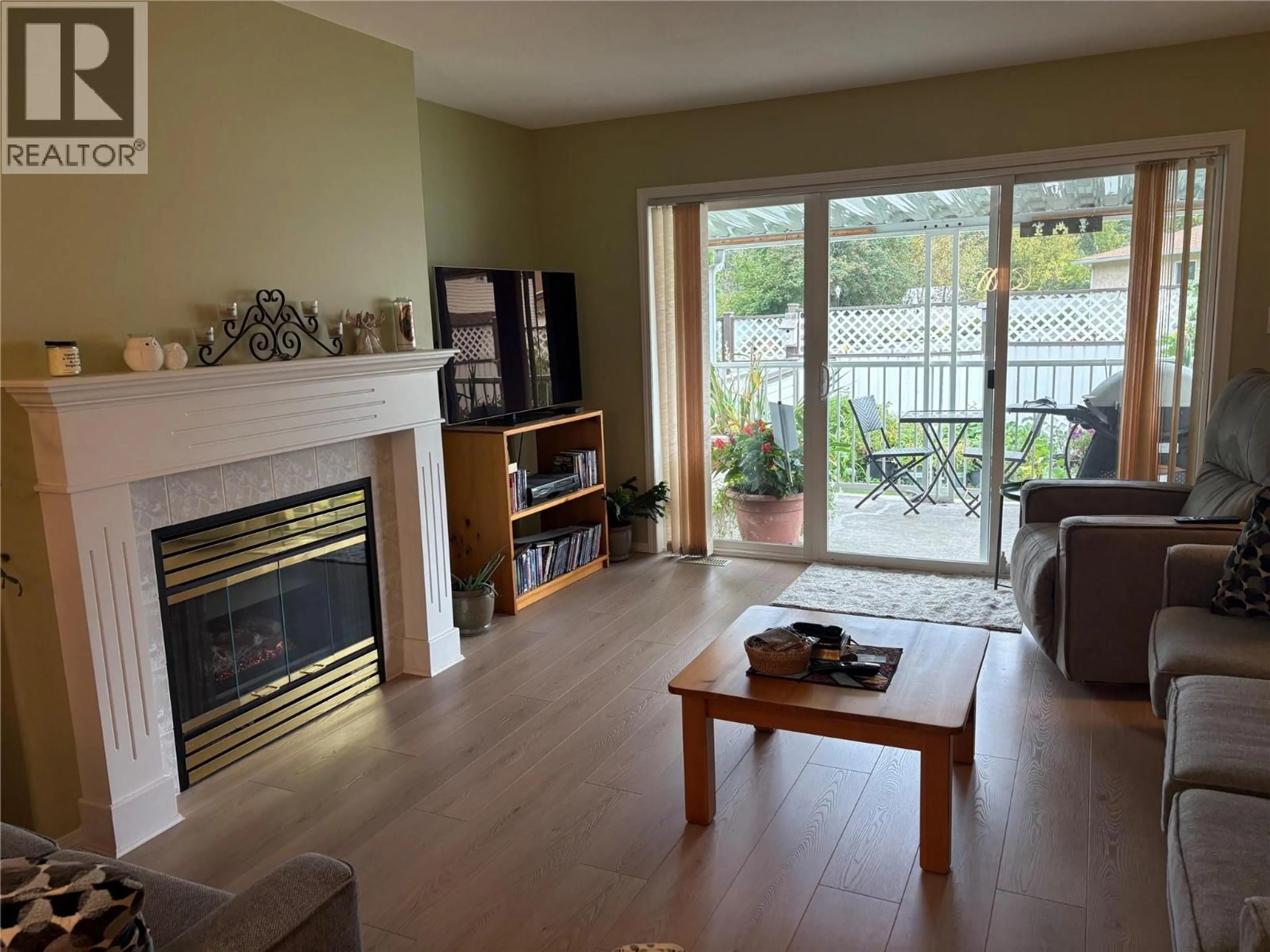 Living room with furniture, wood/laminate floor for 45 - 2210 COLUMBIA AVENUE, Castlegar British Columbia V1N2X1