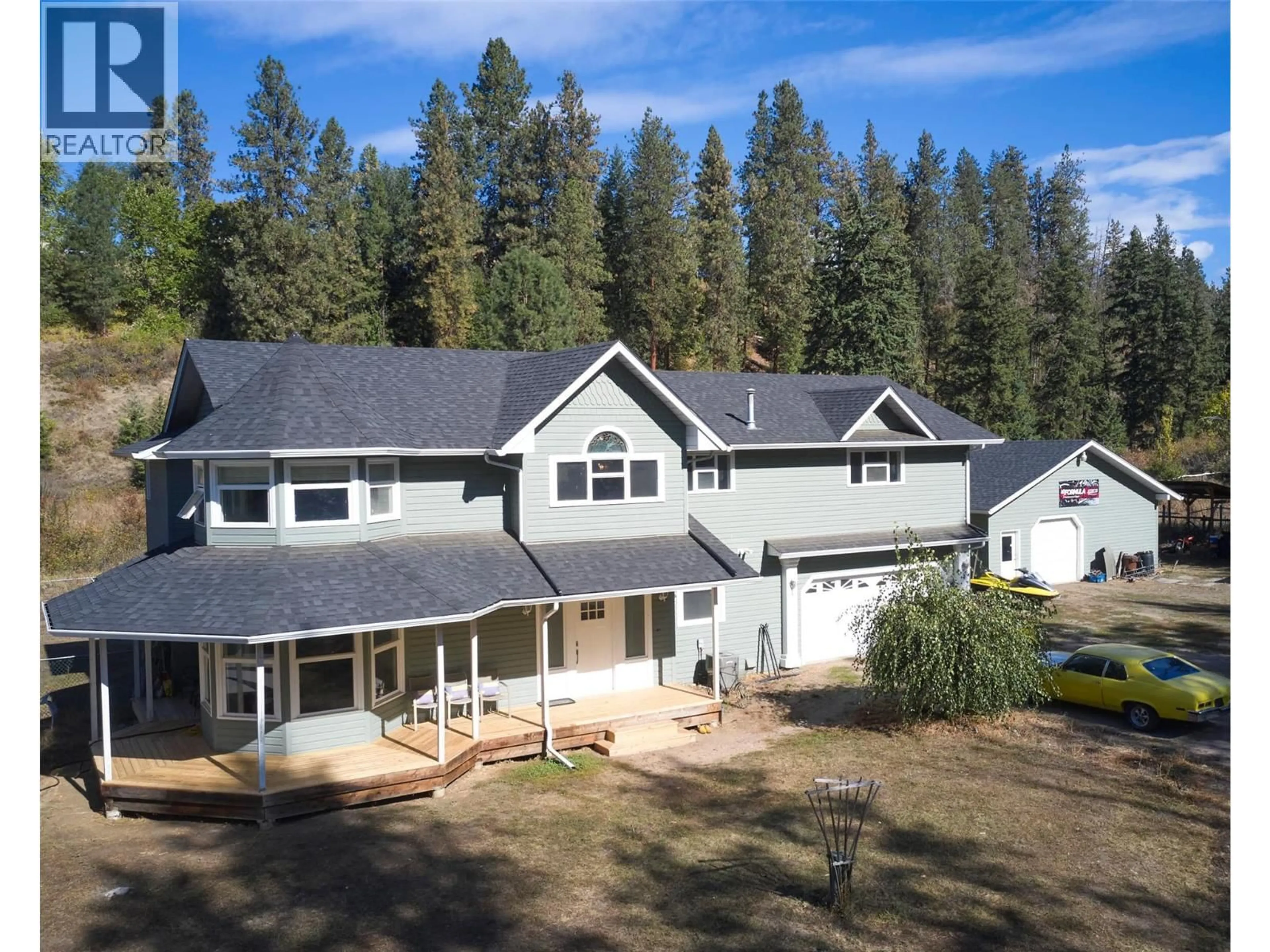 A pic from outside/outdoor area/front of a property/back of a property/a pic from drone, mountain view for 1065 BX ROAD, Vernon British Columbia V1B3K2