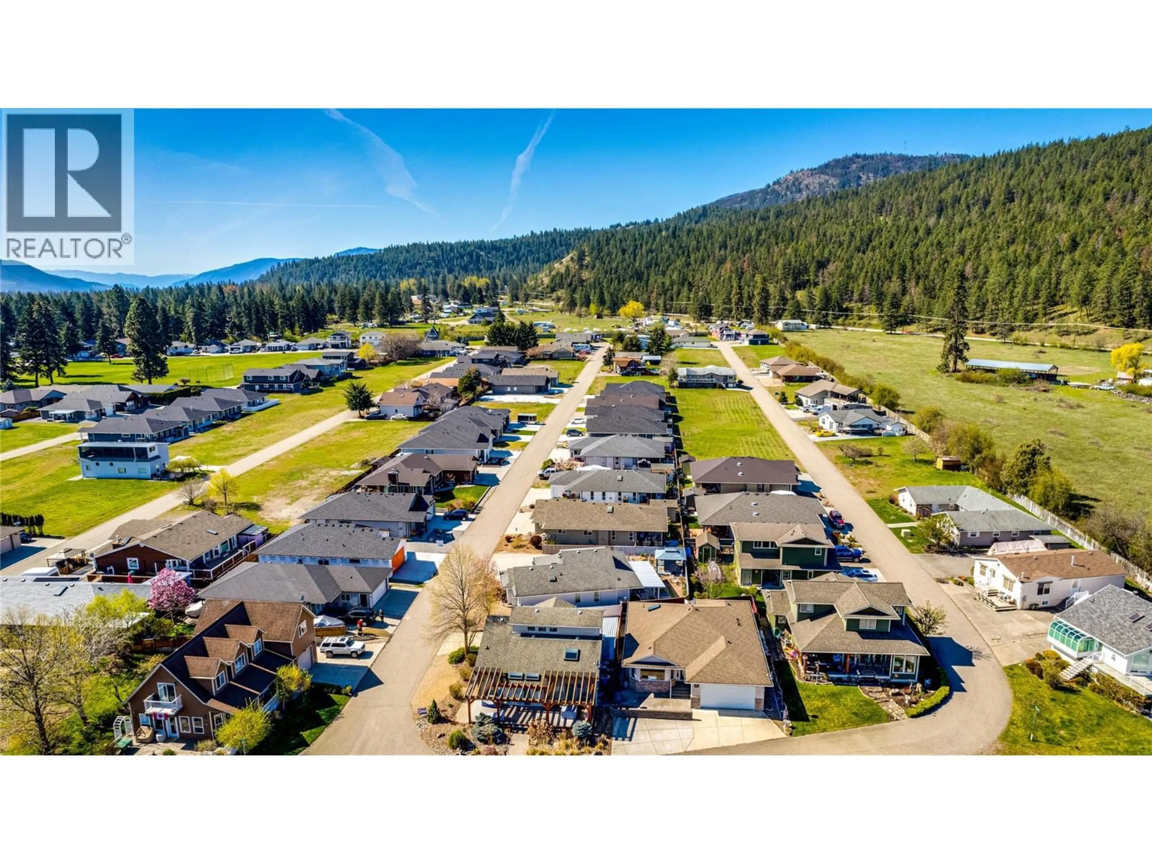 A pic from outside/outdoor area/front of a property/back of a property/a pic from drone, mountain view for 649 ELK STREET, Vernon British Columbia V1H2A1